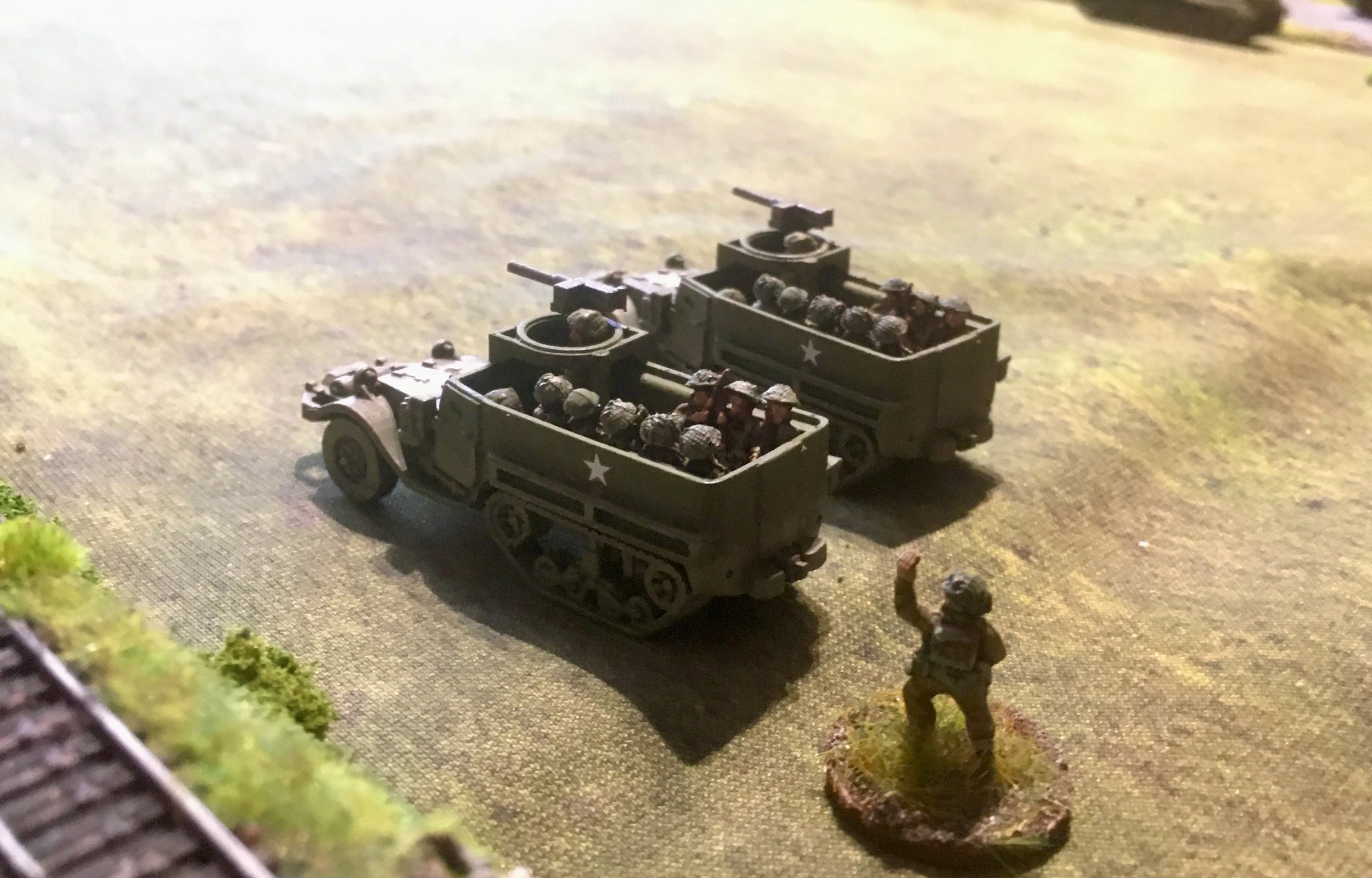 Followed by two M5 half-tracks of the Grenadier Guards in support...