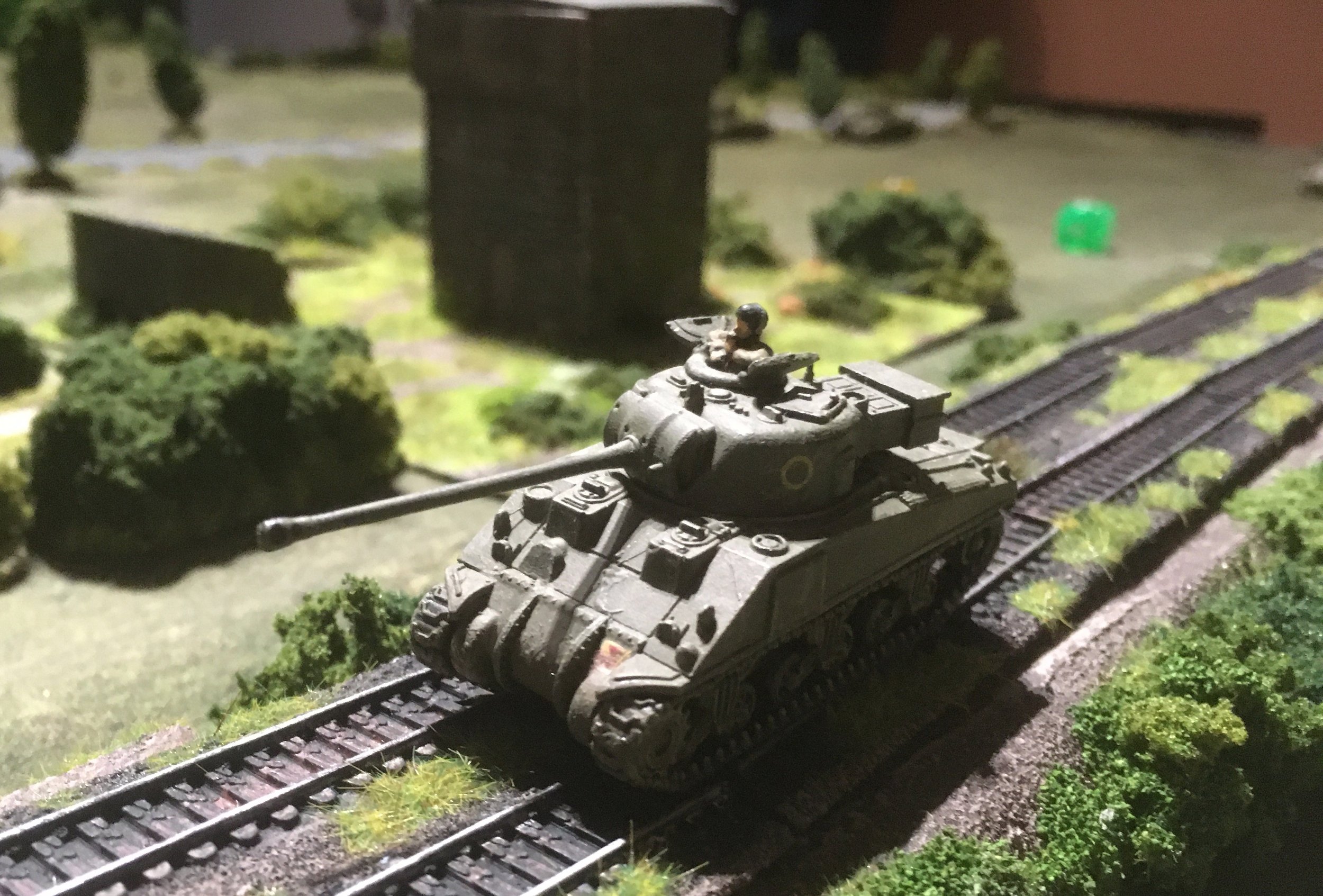 With the flank now open the second troop's Sherman Firefly began to advance down the railway line...