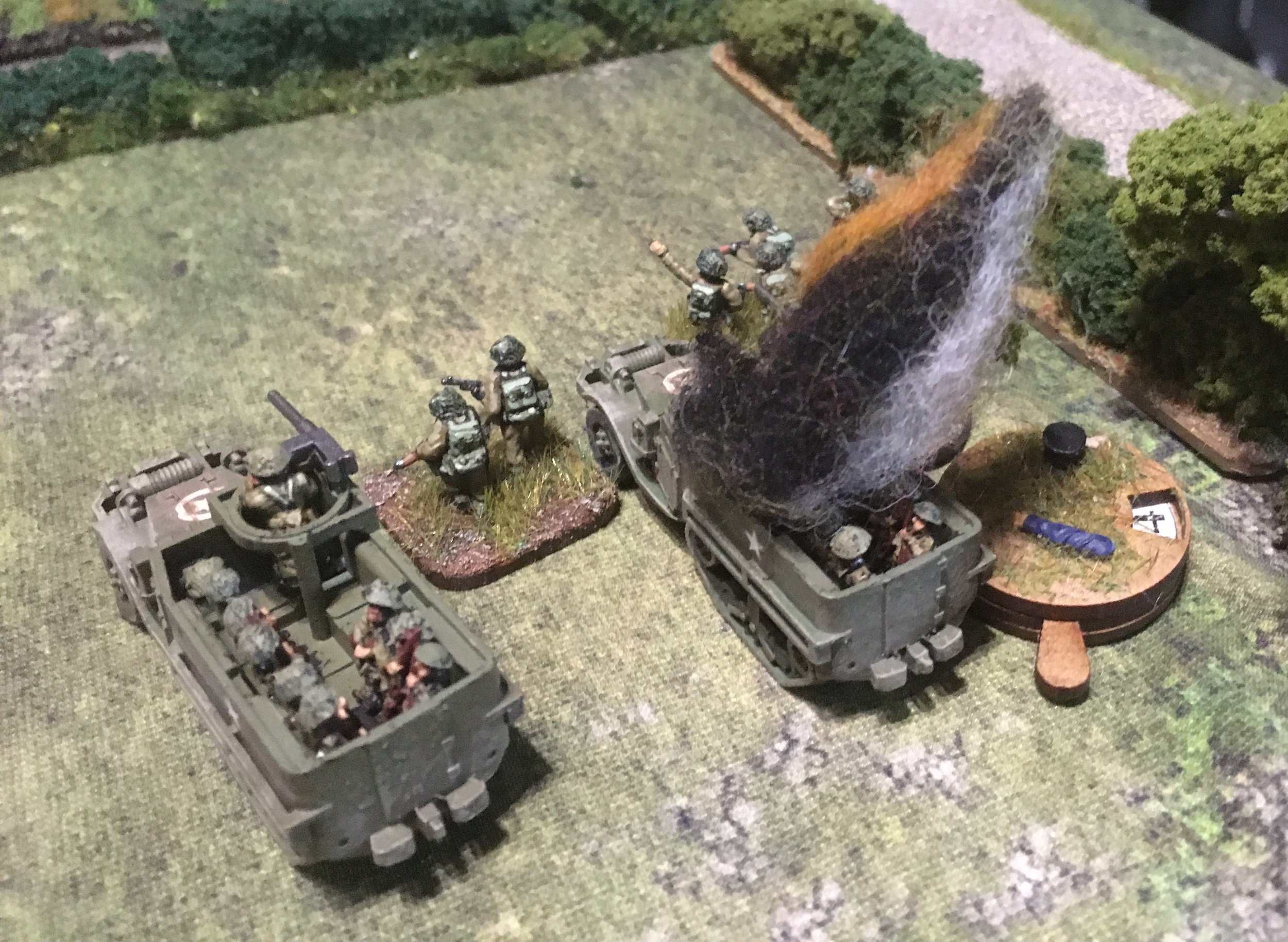 The U304(f) opened fire, its 20mm gun destroying one M5, killing several guardsmen and inflicting Shock on the survivors.