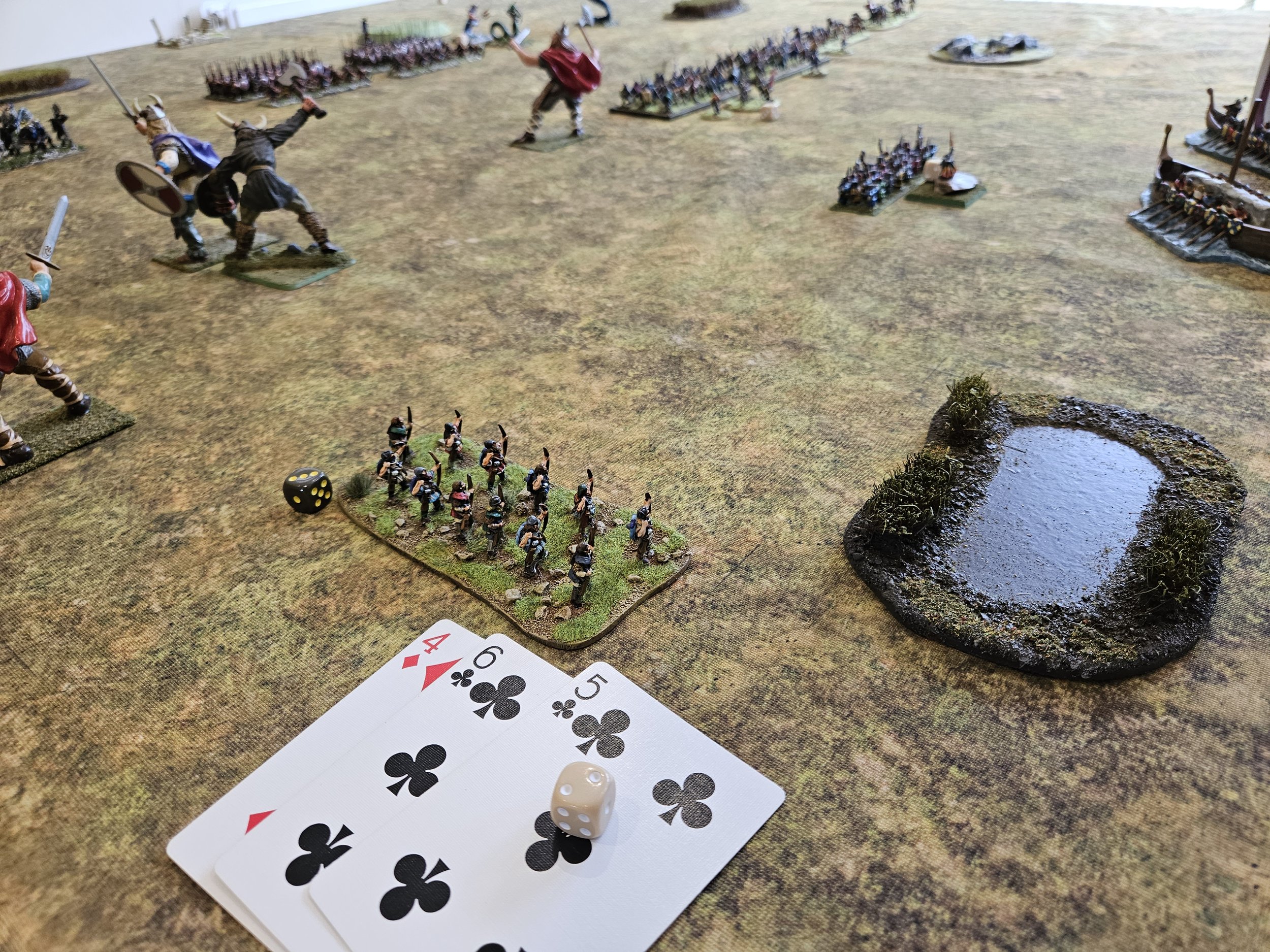  Realising that their camp was vulnerable to aerial attack, the Norse rushed some light archers back towards it. Here you see two successful activations followed by an initial fail, but two magic points from the Jotun Officer/Shaman (in the backgroun