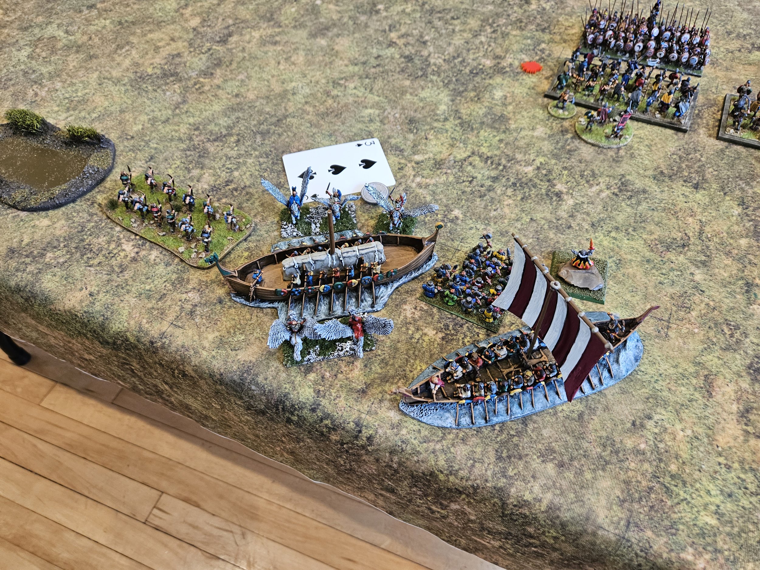  Having exchanged missile fire with the Norse lights, the Pegasus Cavalry perform another difficult activation to actually land in the Norse camp. They gain three coins, but can they keep them? 