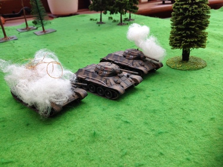 Two T-34s are brewed up