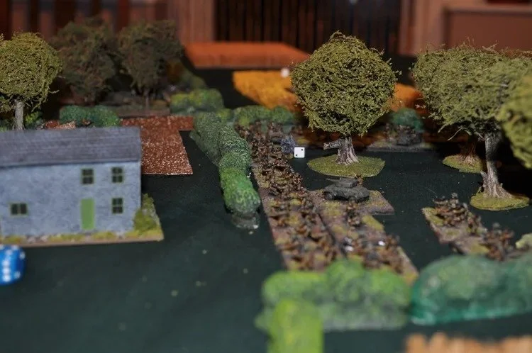 Looking slightly Napoleonic, 1st Platoon take positions in an orchard facing more Germans (Behind the building from the camera)