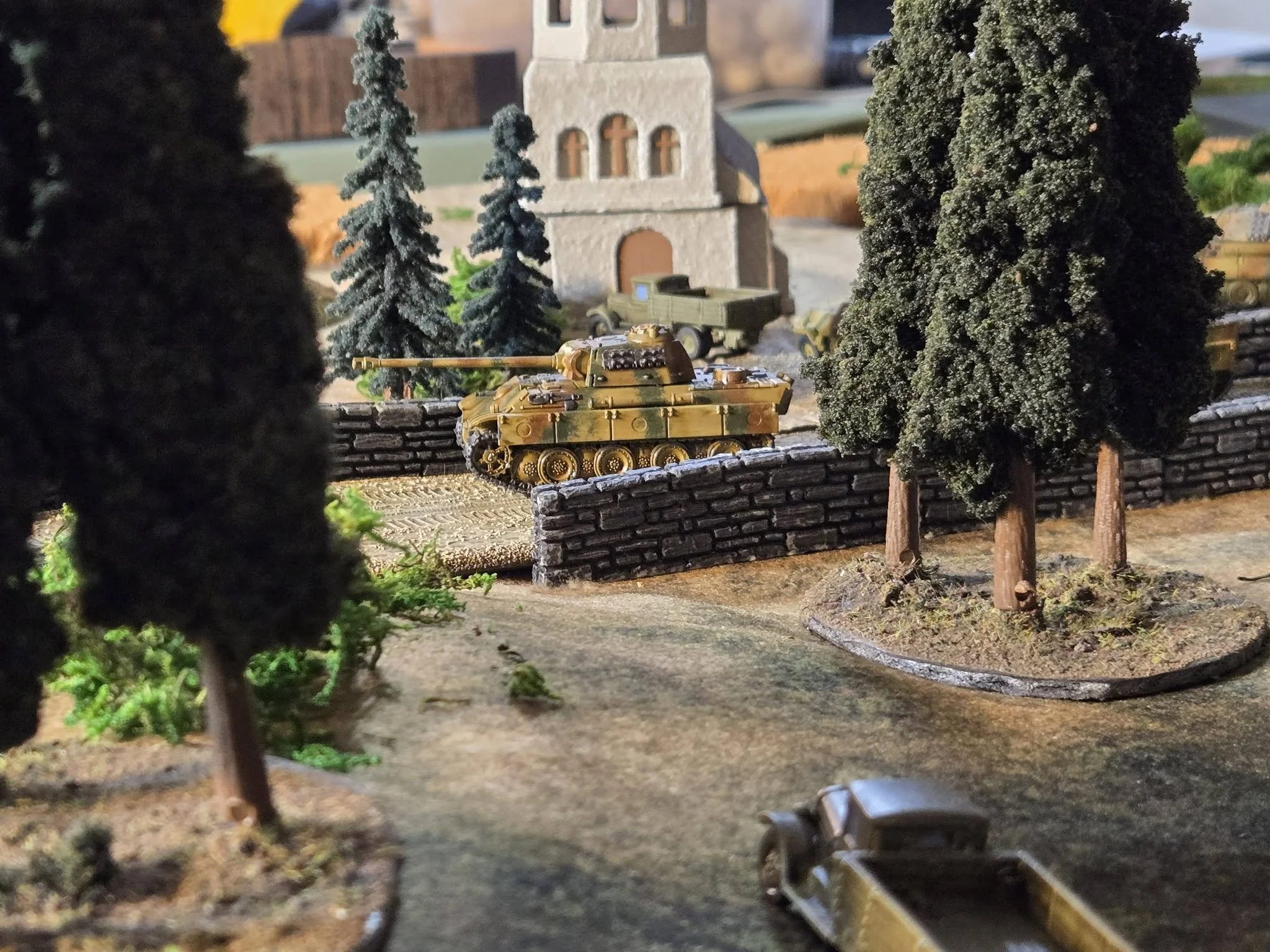 A Panther drives through the village after the Soviet rout