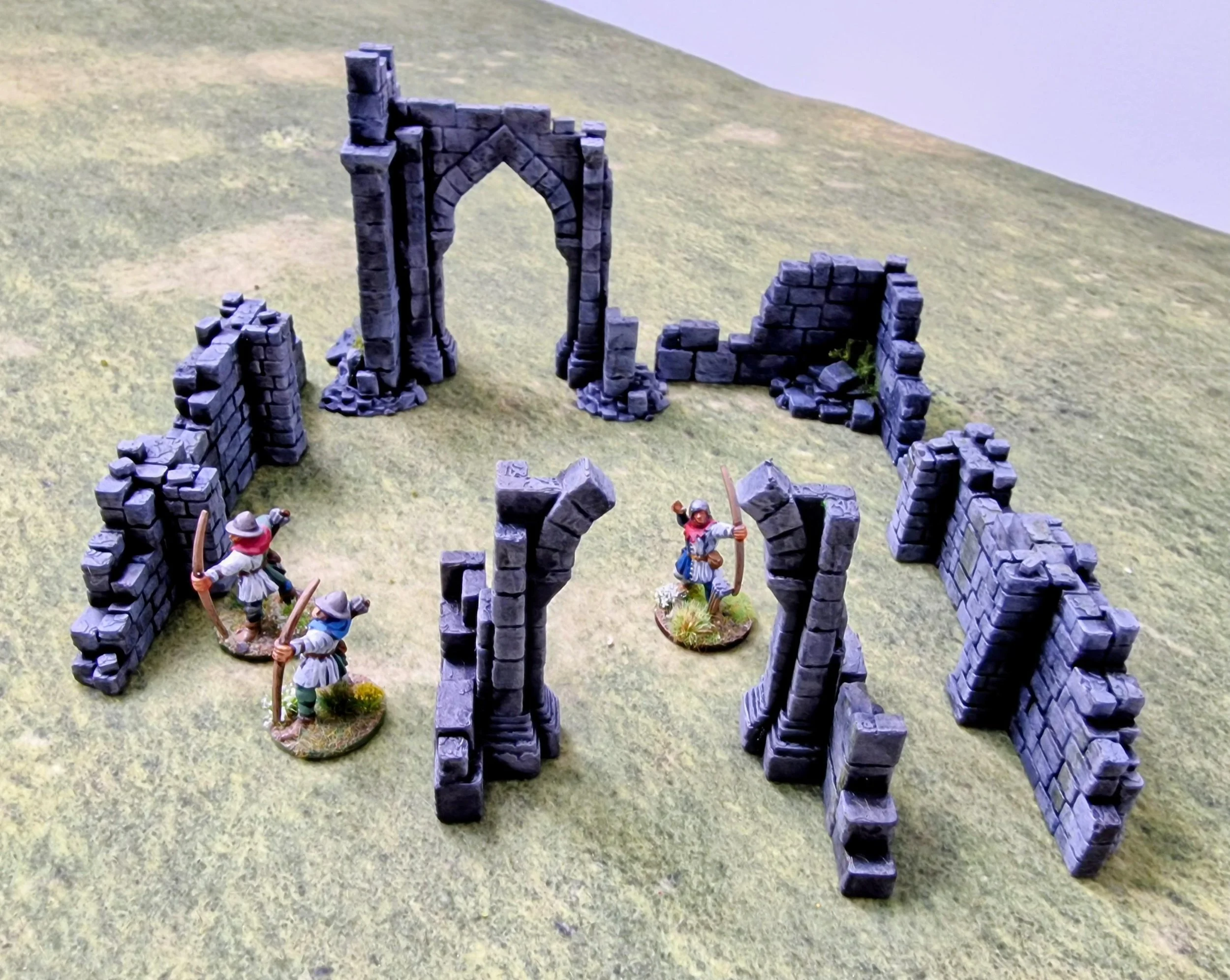  All the newly printed terrain on my table with some old Games Workshop archers. 