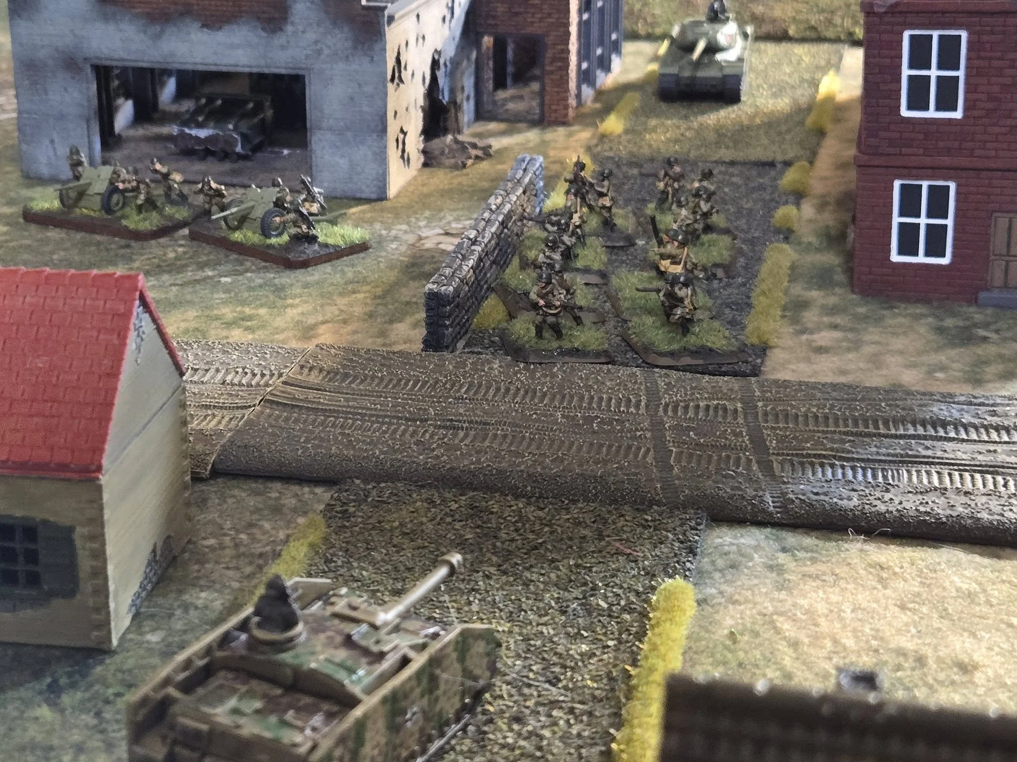  A Stug IV, hoping to pick off Soviets as they evacuate the cement factory, is suprised to find an IS-2 rolling down the street. 