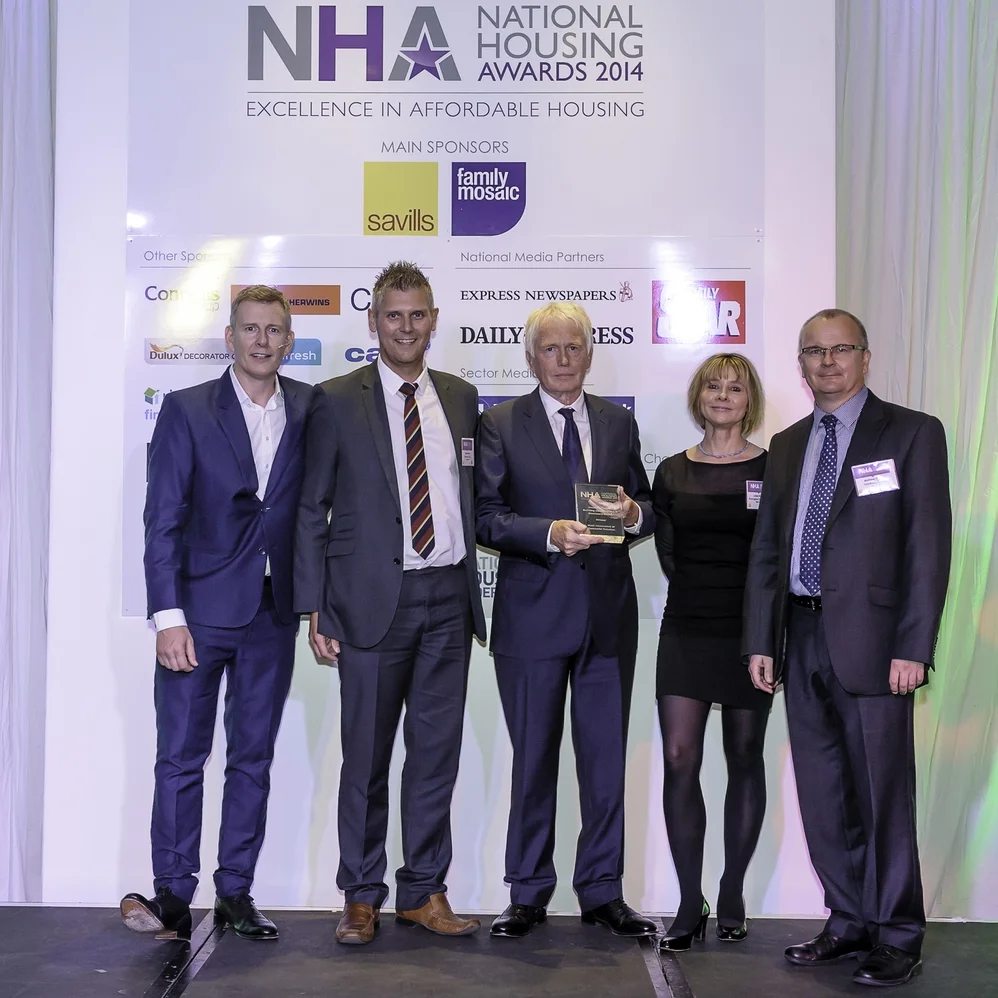 Pictured at the National Housing Awards, l-r, Patrick Kielty, Mark Birkin, of Sanctuary Group, HPBC trustee Jim Gill, Linda Storey of category sponsor Penningtons Manches, and Sanctuary’s Andrew White.