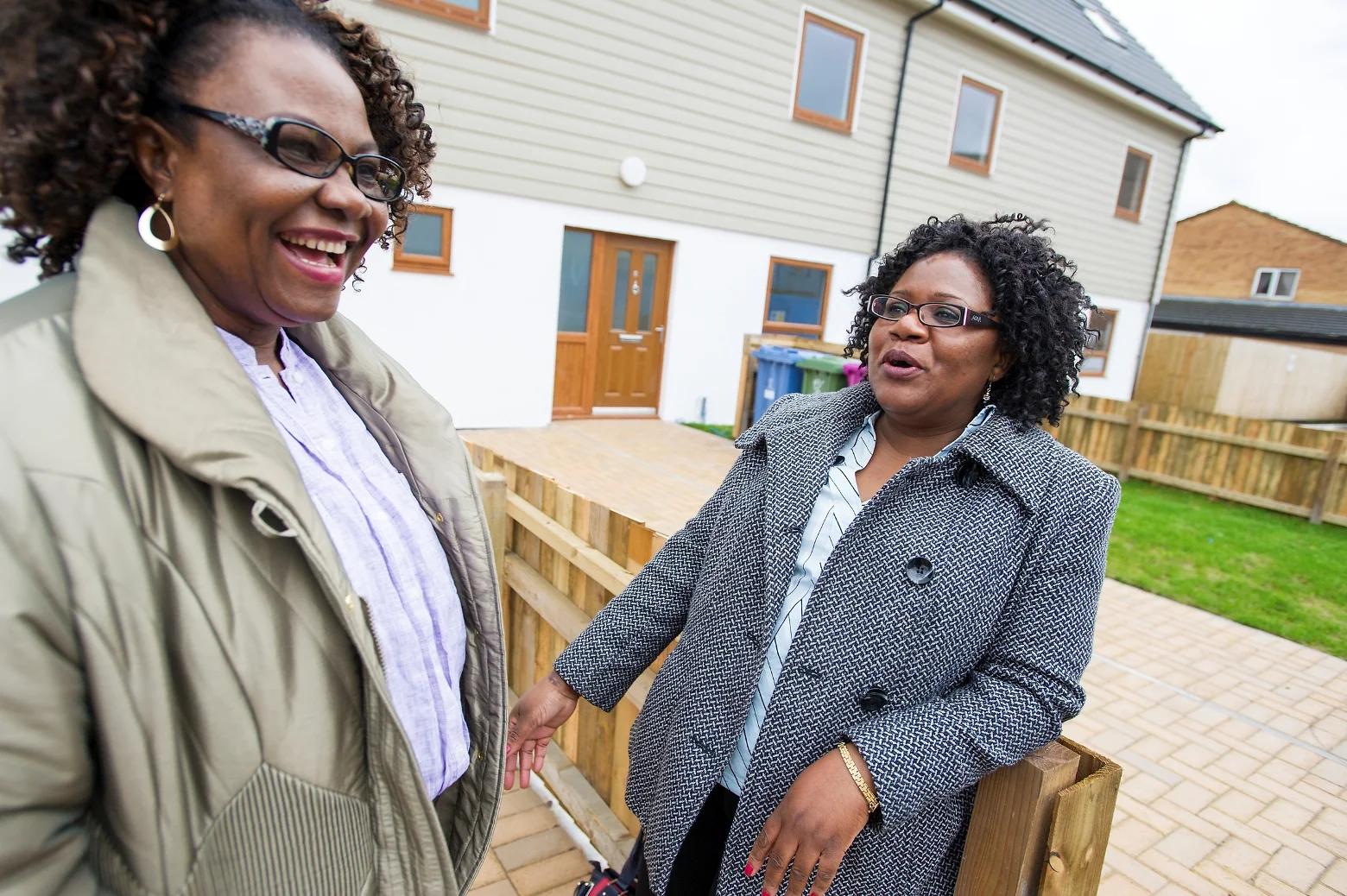 HPBC home partners Florence Obiaju (left) and Joyce Msiska outside some of the recently completed homes.