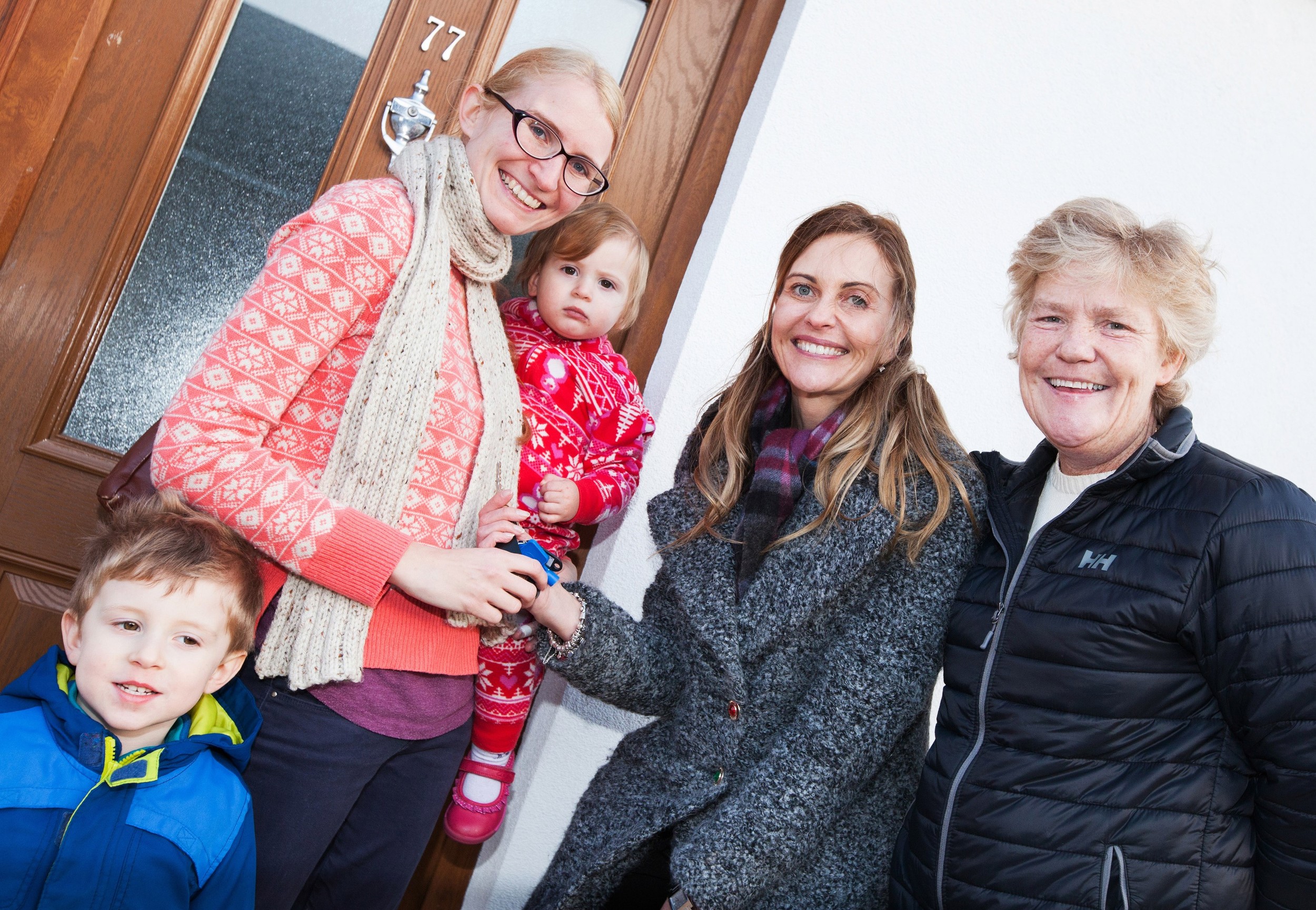 Wienerberger director of marketing Annette Forster presents keys to home partner Stephanie Pitchers with children Elodie and Ben and HPBC chief exec Liza Parry.jpg