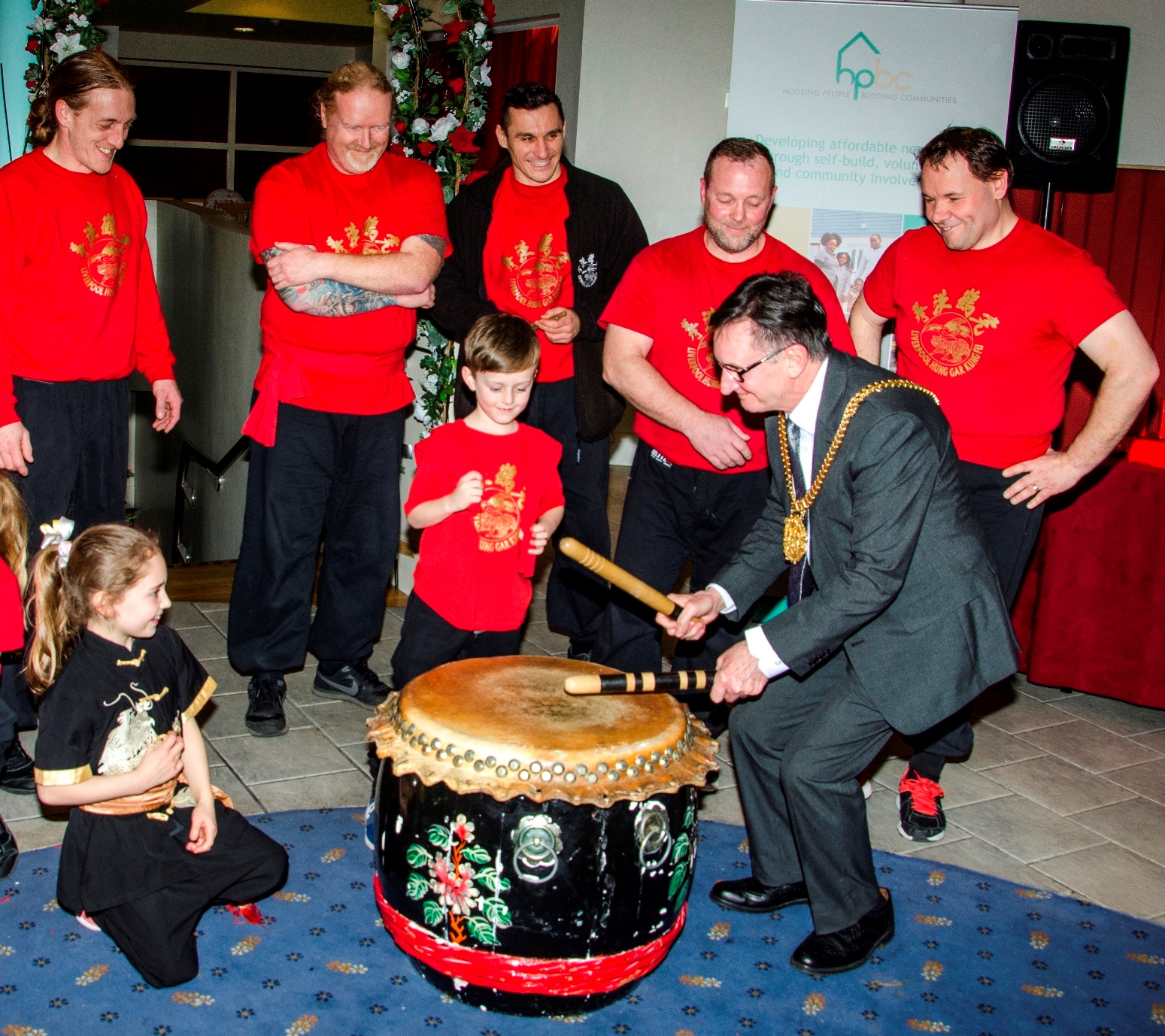  Liverpool’s Lord Mayor Cllr Tony Concepcion bangs the drum, watched by members of Liverpool Hung Gar Kung Fu school. 