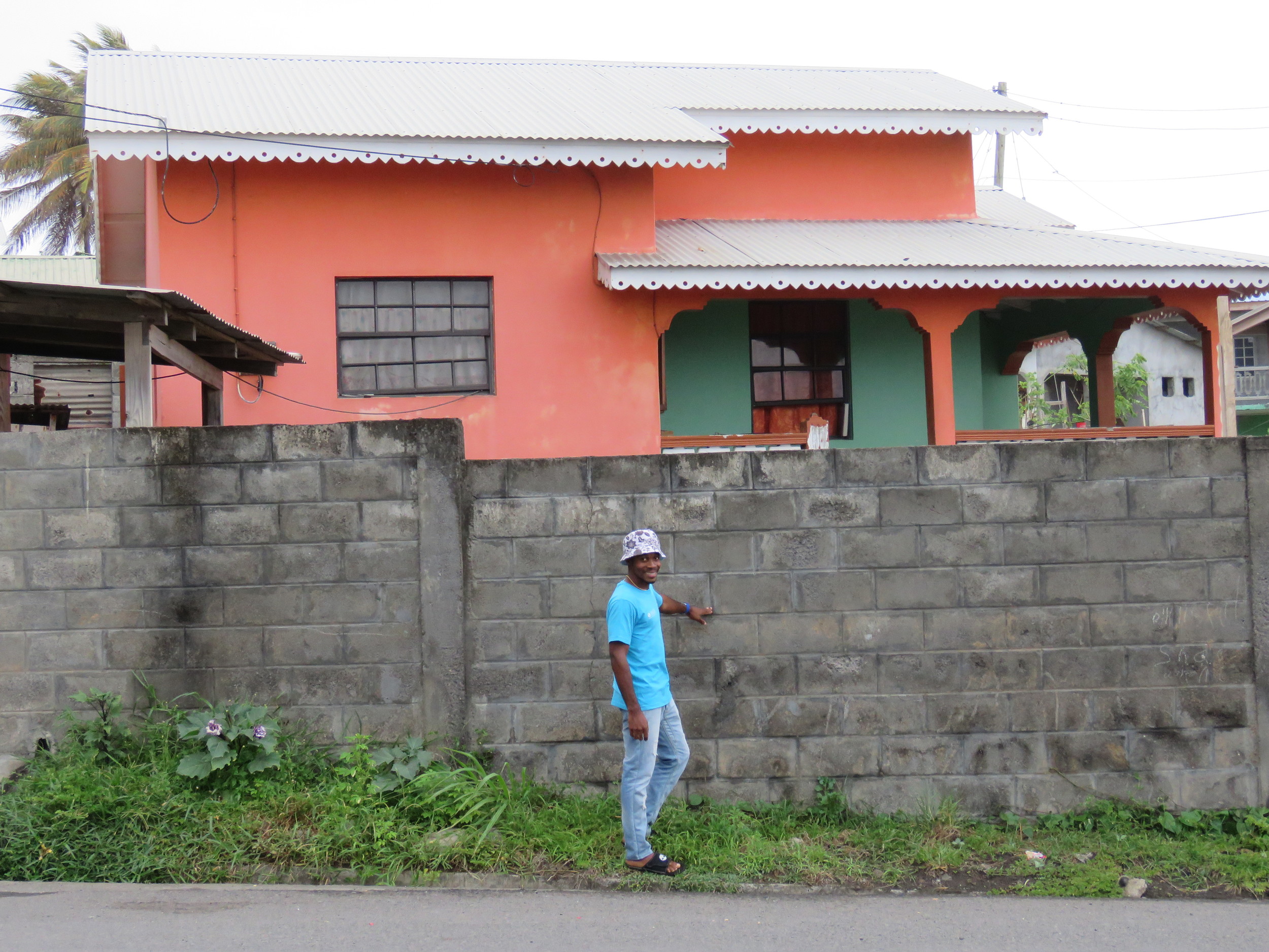 Eshron points to the water line from the flooding in 2013 on the wall in front his Georgetown home.