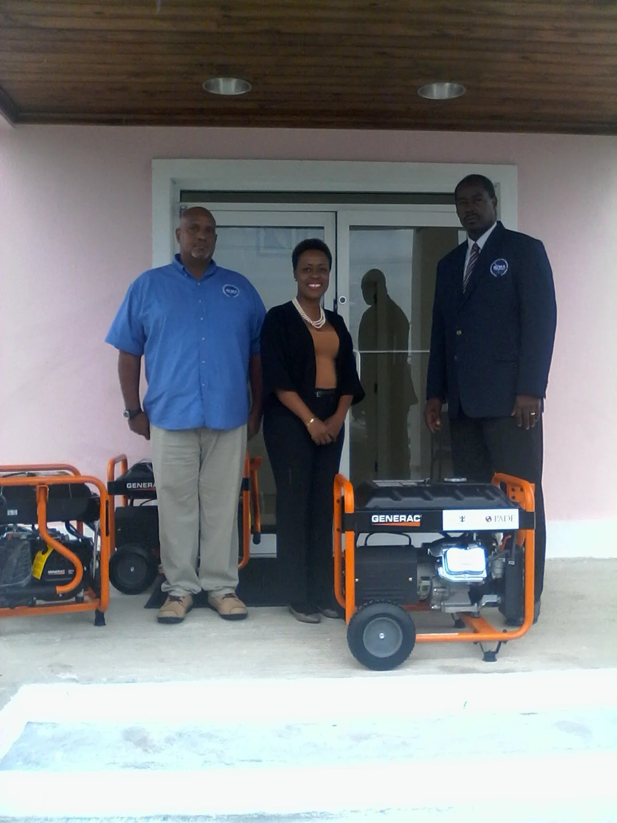 Charo Morley presents household generators to Director of NEMA Bahamas Captain Stephen Russell on behalf of PADF and Royal Caribbean.