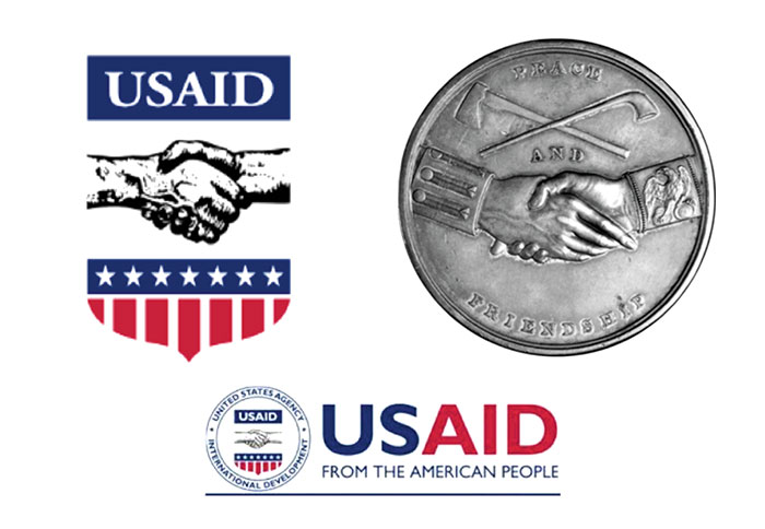The USAID logo we know today bears a distinct resemblance to the Jefferson Peace Medal, as shown here. Peace and friendship medals minted in silver by the U.S. government were an aspect of diplomacy with Native Americans and others during the 18th and 19th centuries. Jefferson Peace Medal / Oregon Historical Society