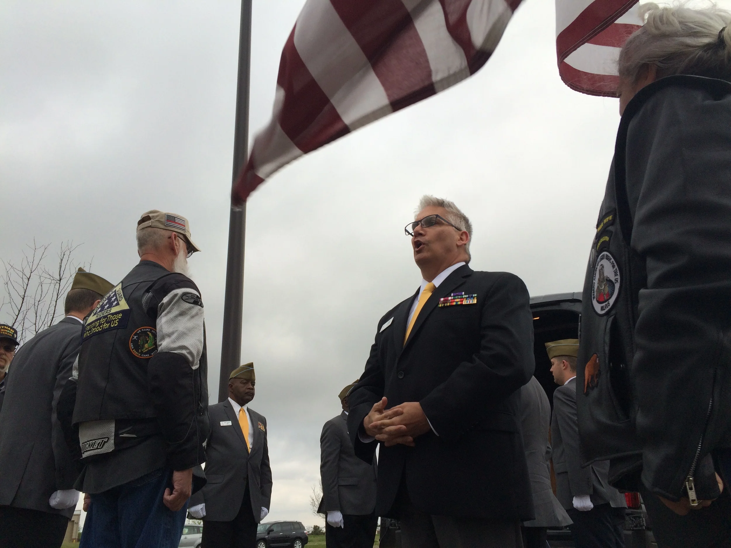 Executive Director Lou Olivera delivers remarks prior to departing with the Honor Bell Team and rider escorts.