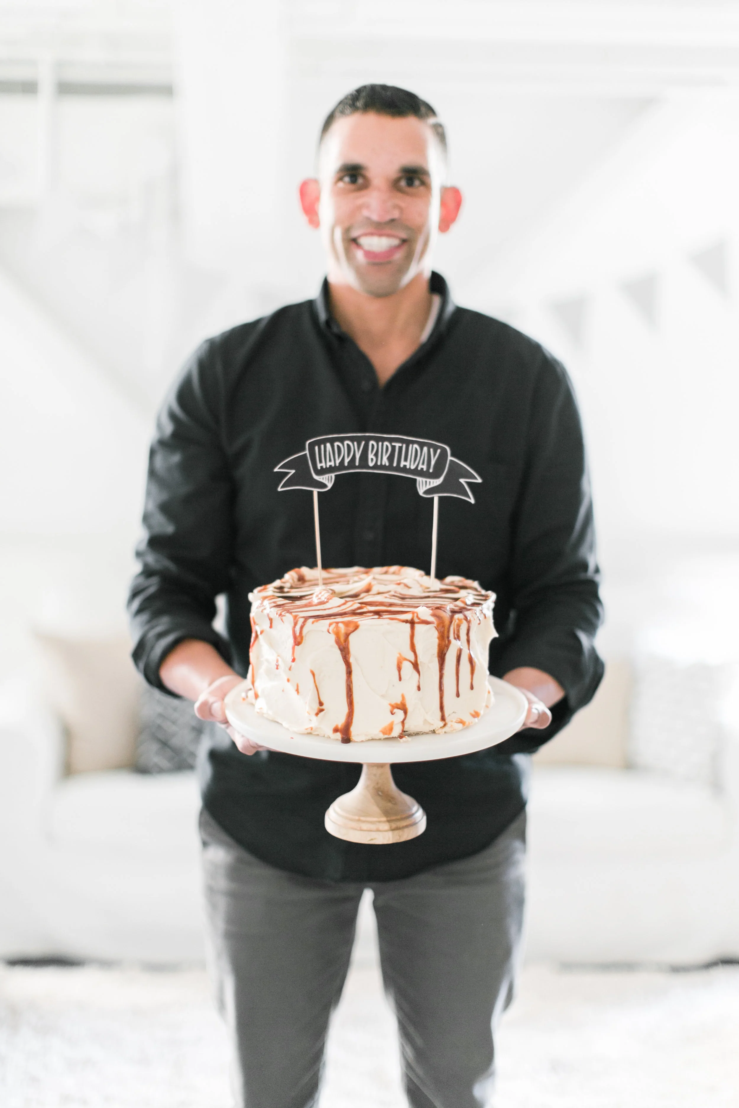 STEVE DISPLAYING OUR CUSTOM CAKE TOPPER.