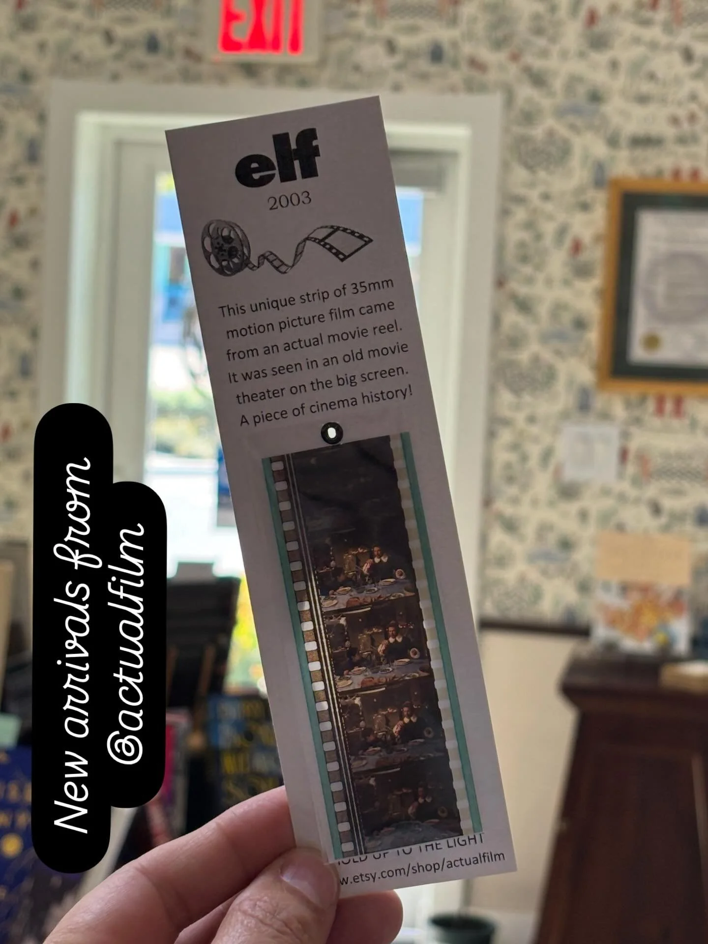 Look closely and you&rsquo;ll see Buddy, the elf.  These filmstrip bookmarks are a terrific stocking stuffer and we have lots of classic movies to choose from! #bookmark #greatgift #holidaycheer