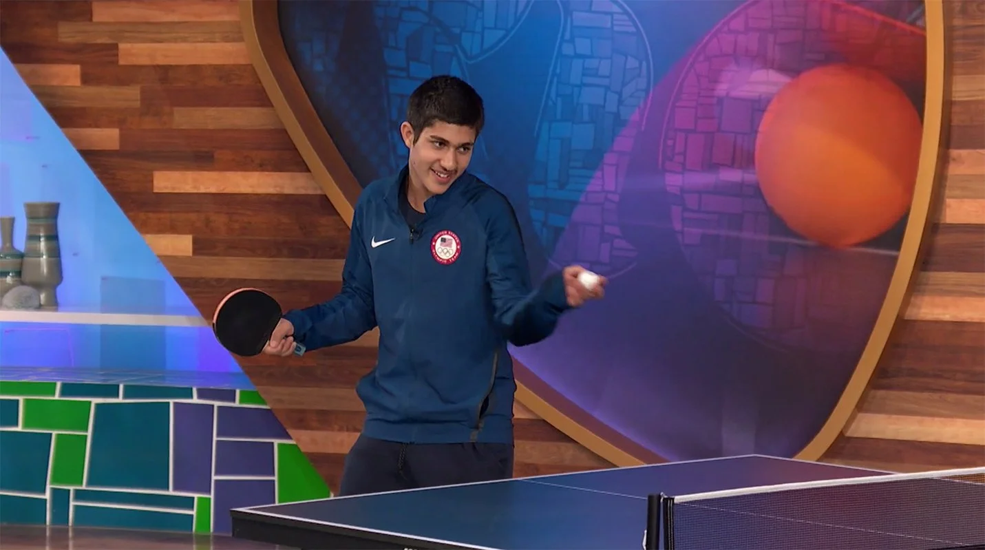 An Olmypic in NBC Sports' Studio A at the 2016 Rio Olympics playing ping pong