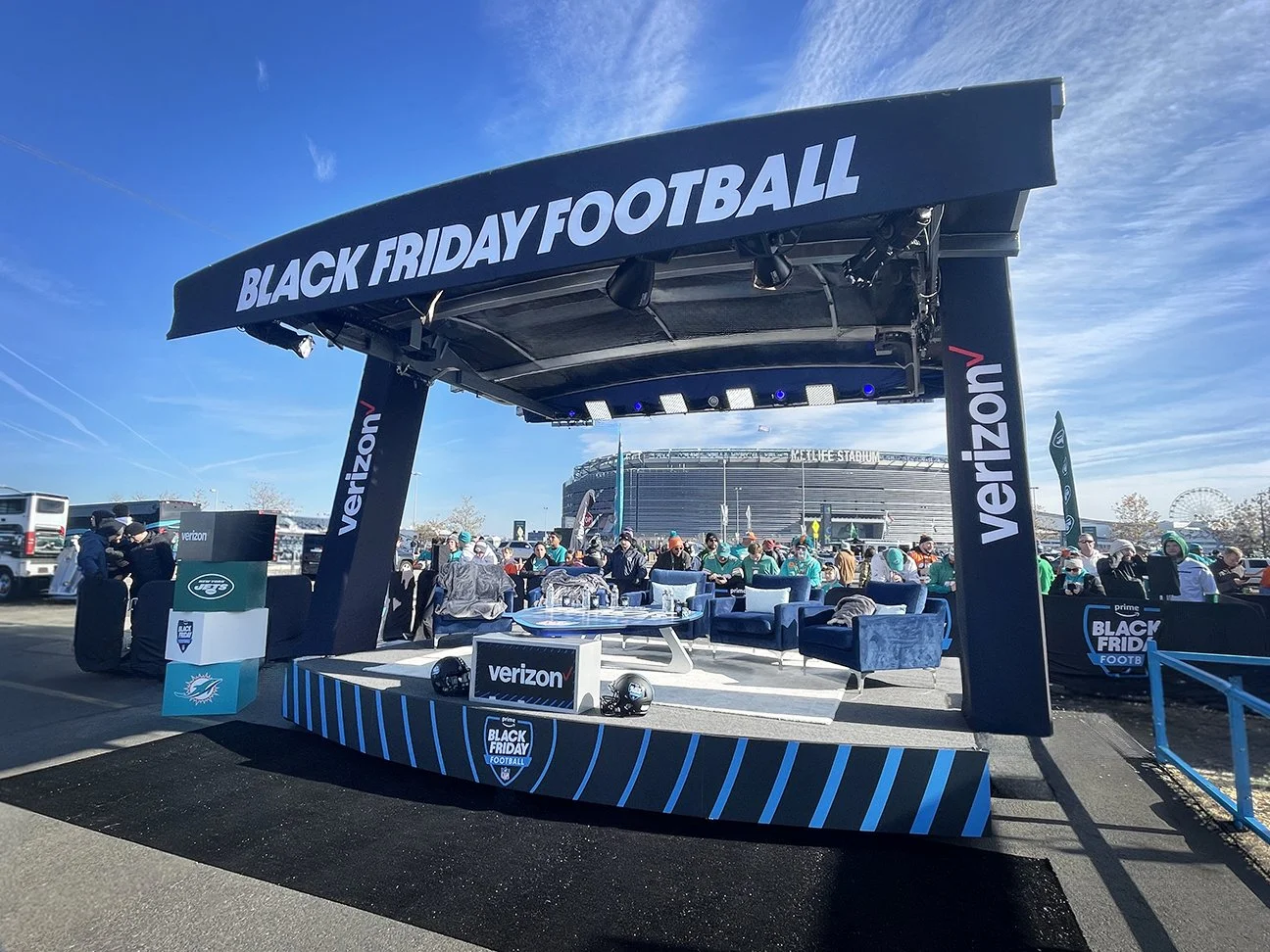 Black Friday Football Amazon Prime platform area with club chairs and metlife stadium behind