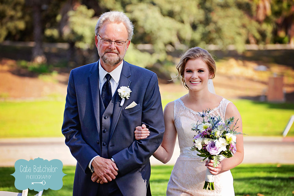 Leslie's father walks his daughter down the aisle.