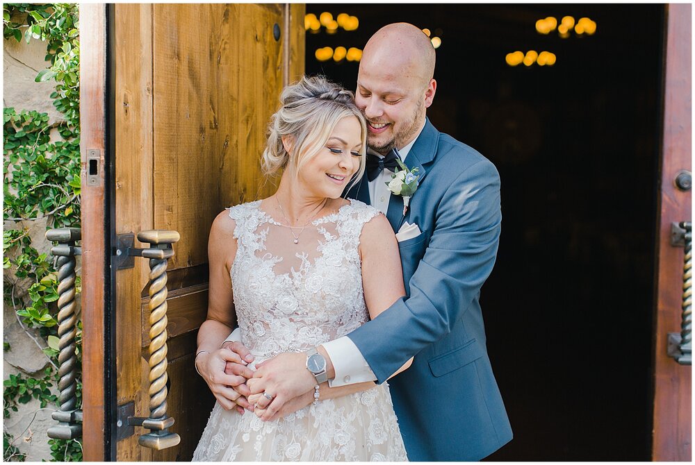 Bride and groom portrait outside barrel room at Ponte Winery in Temecula