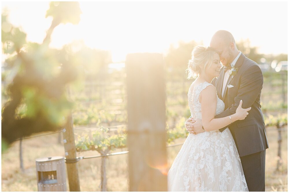 Sunset photos of bride and groom in vineyard