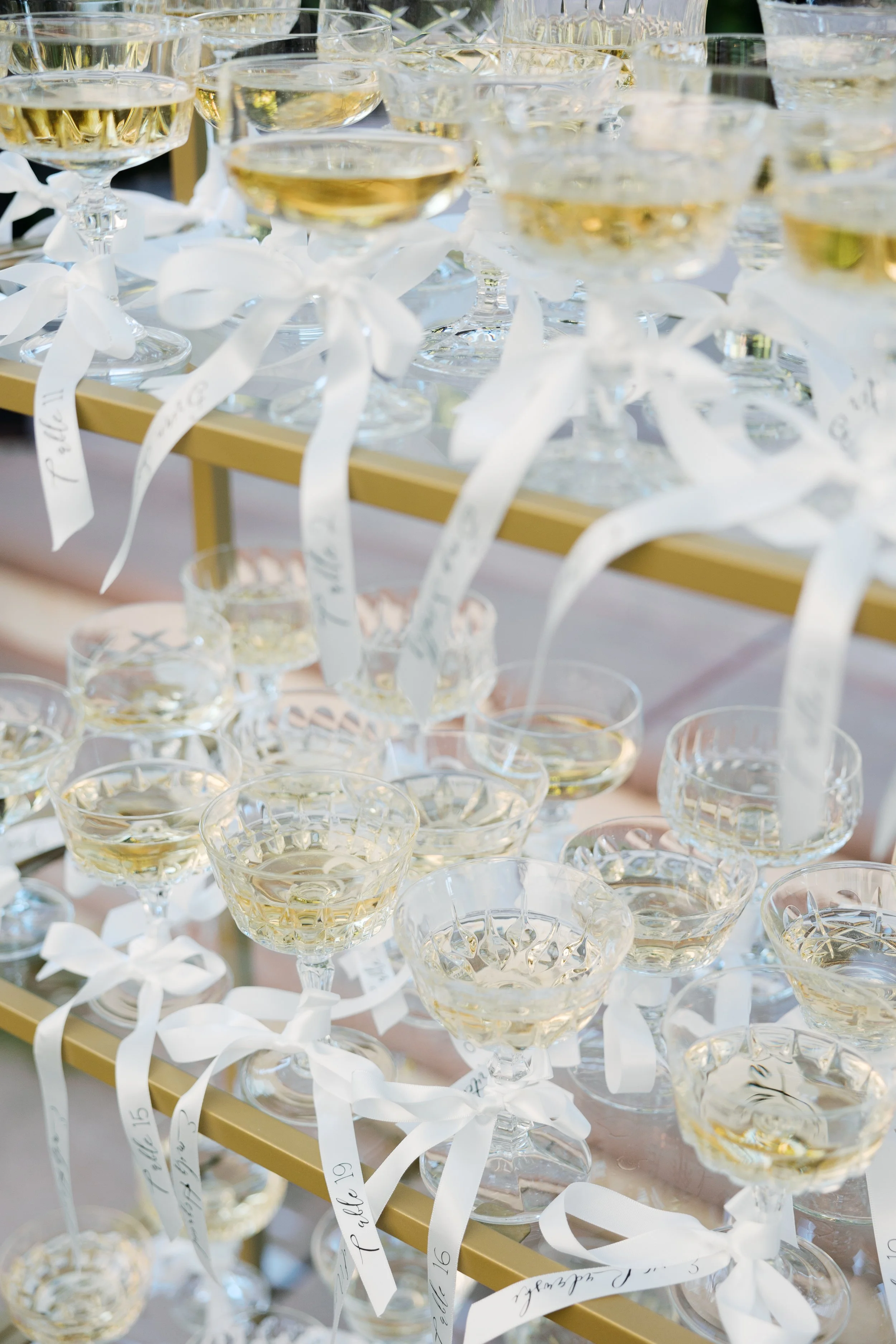 Champagne wall guest seating chart detail at Tivoli Italian Villa wedding in Escondido, California