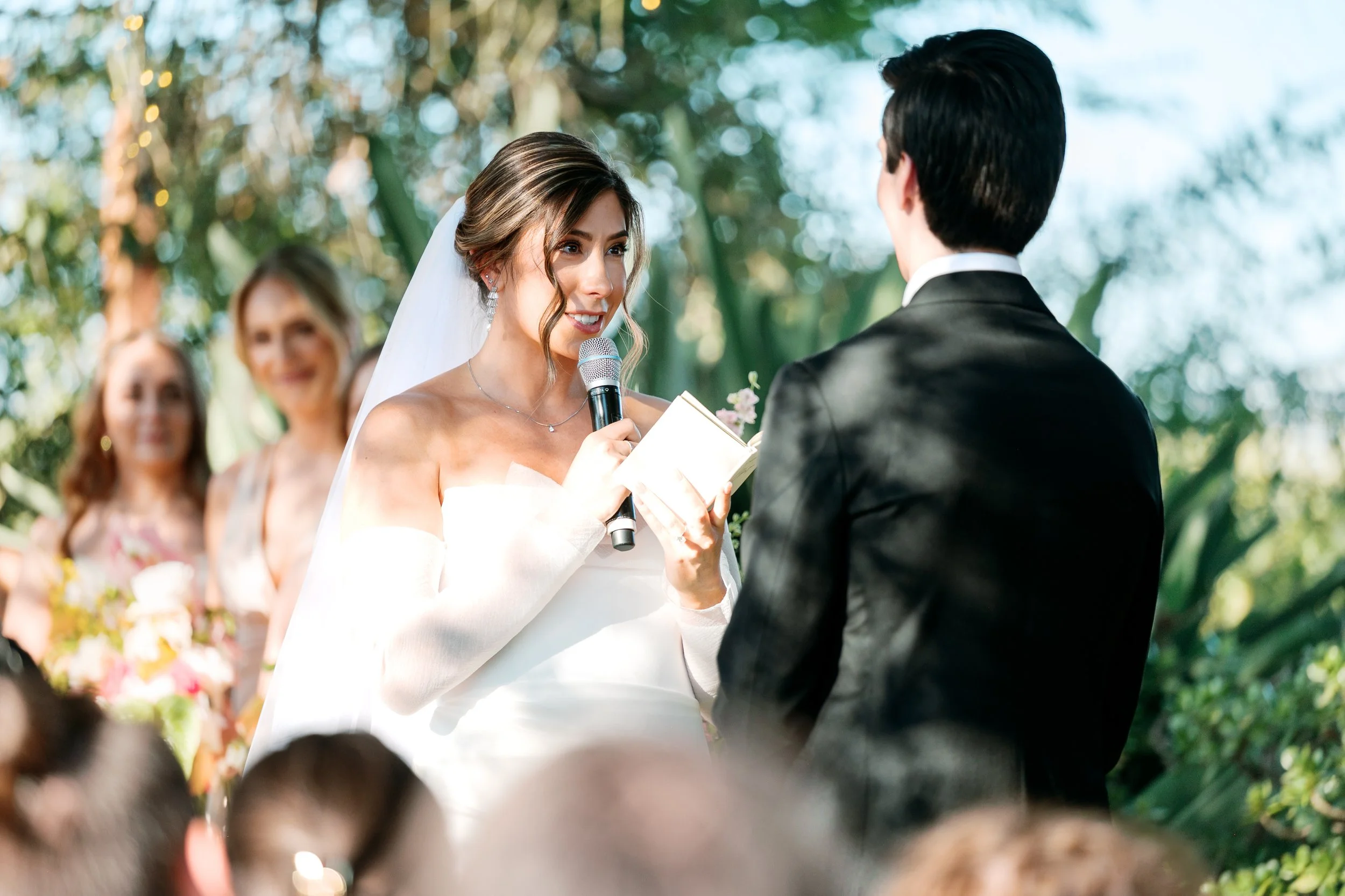 Bride saying her vows during the wedding ceremony at Tivoli Italian Villa in Escondido, California