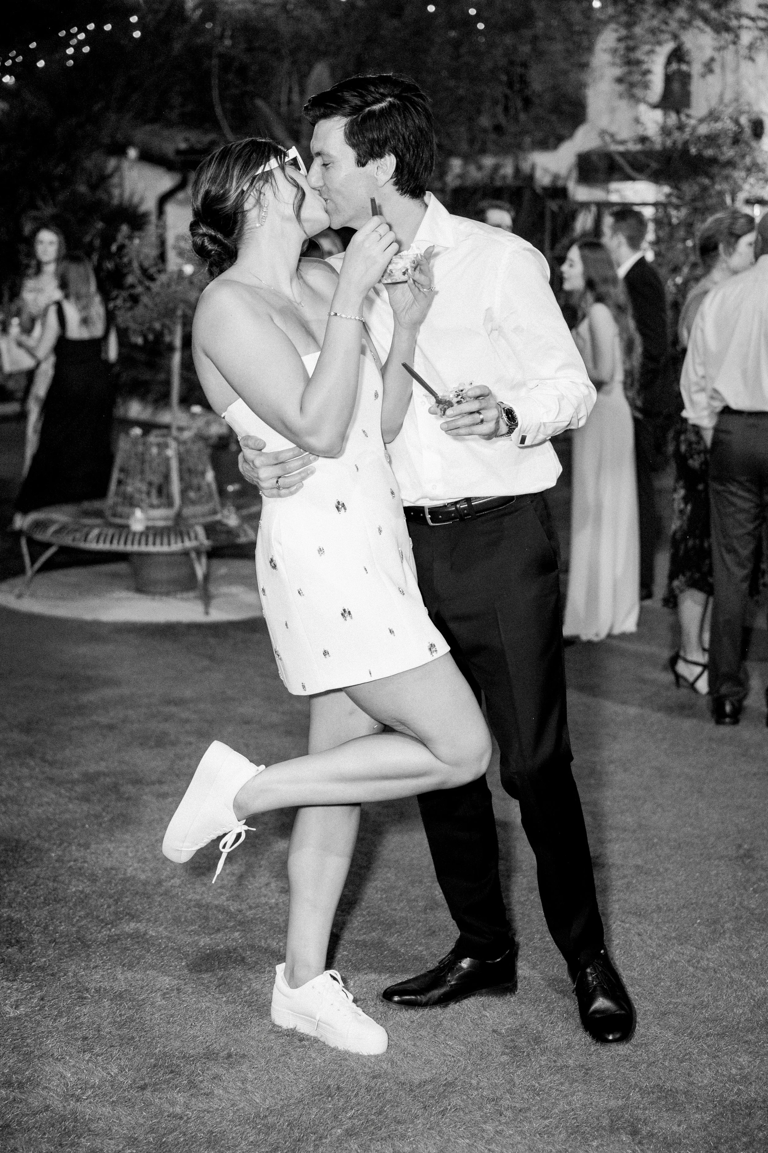 Bride and groom at ice cream bar during wedding reception at Tivoli Italian Villa in Escondido, California