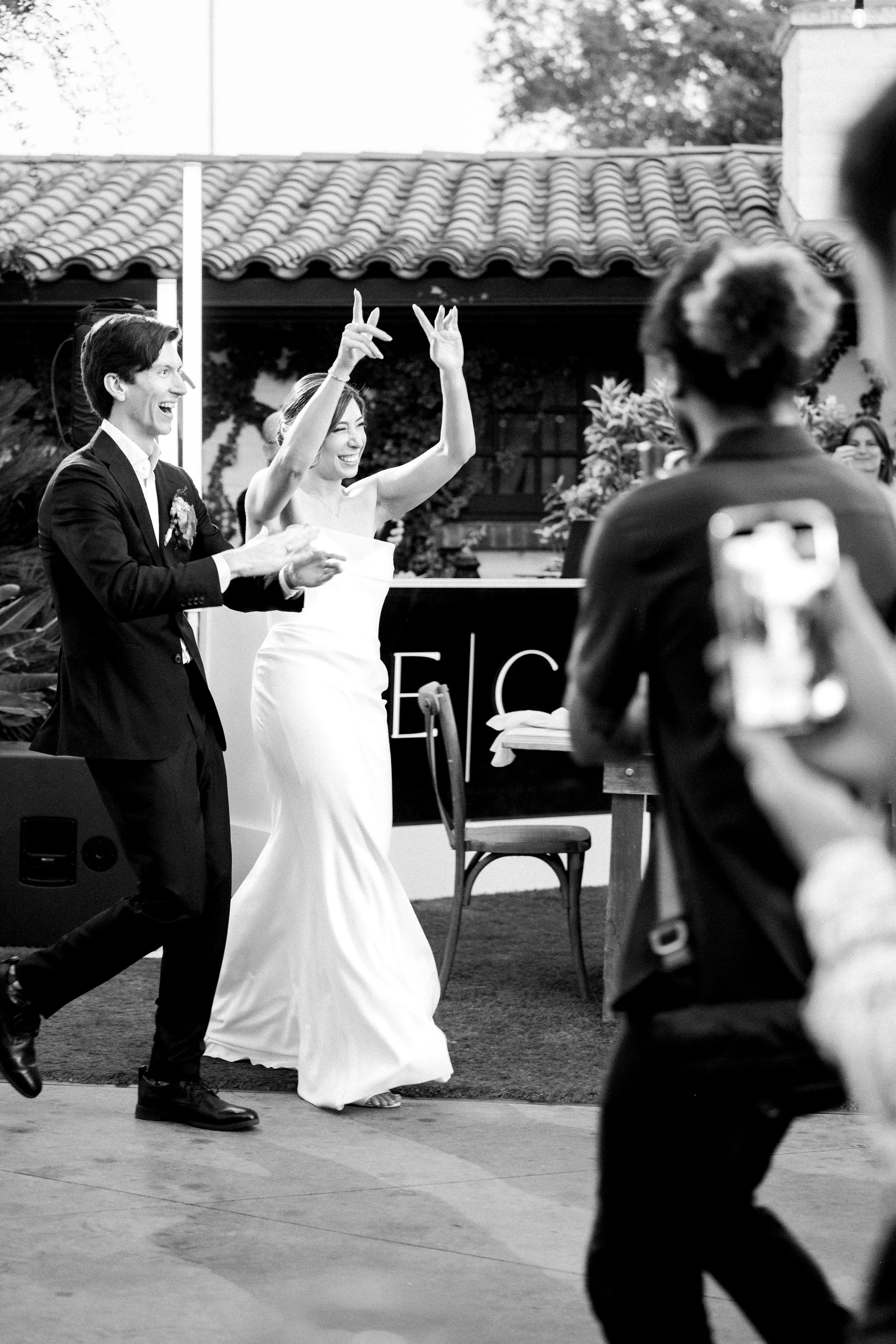 Bride and groom making their grand entrance at Tivoli Italian Villa wedding reception in Escondido, California