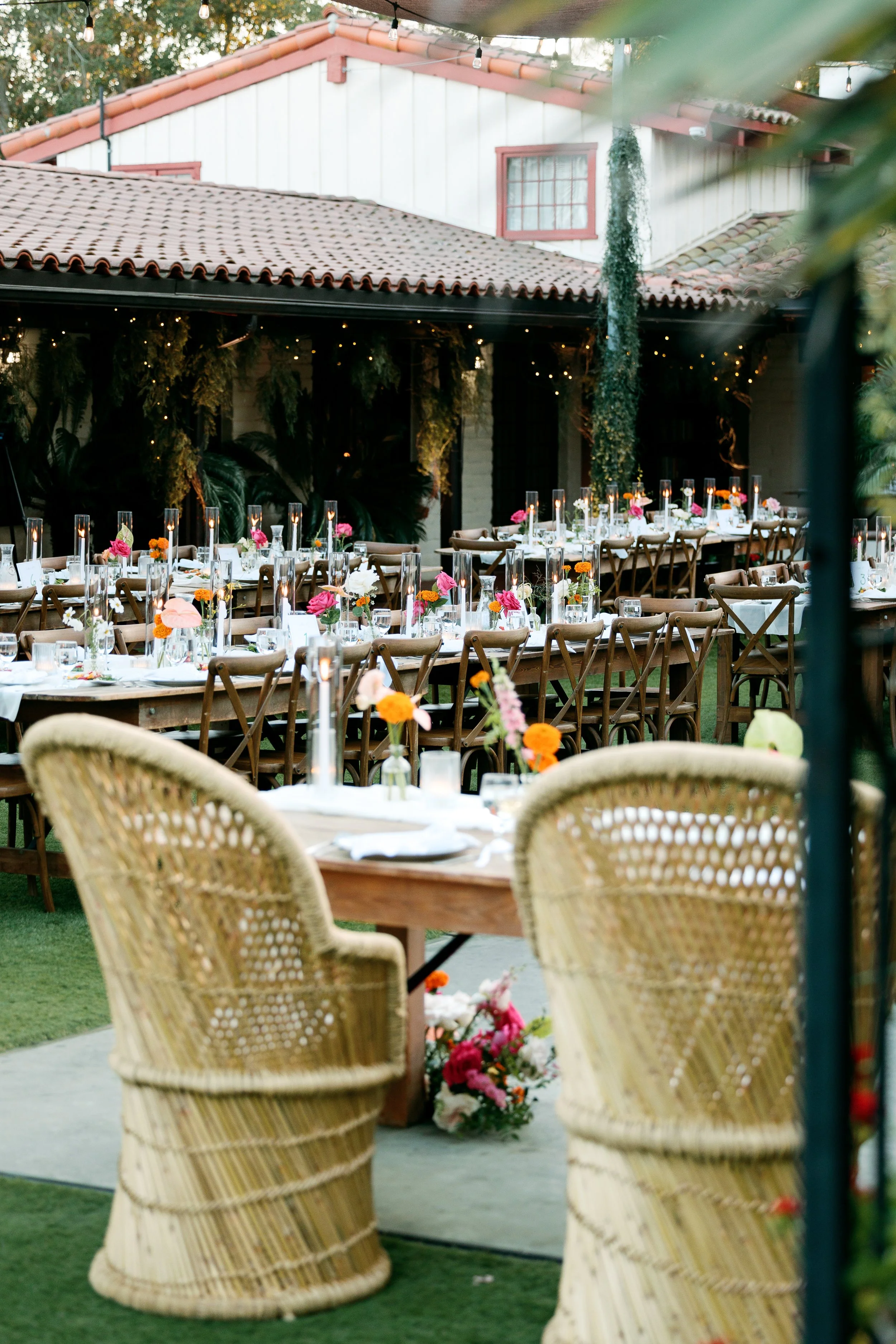 Reception table detail with floral arrangements and place settings at Tivoli Italian Villa wedding in Escondido, California