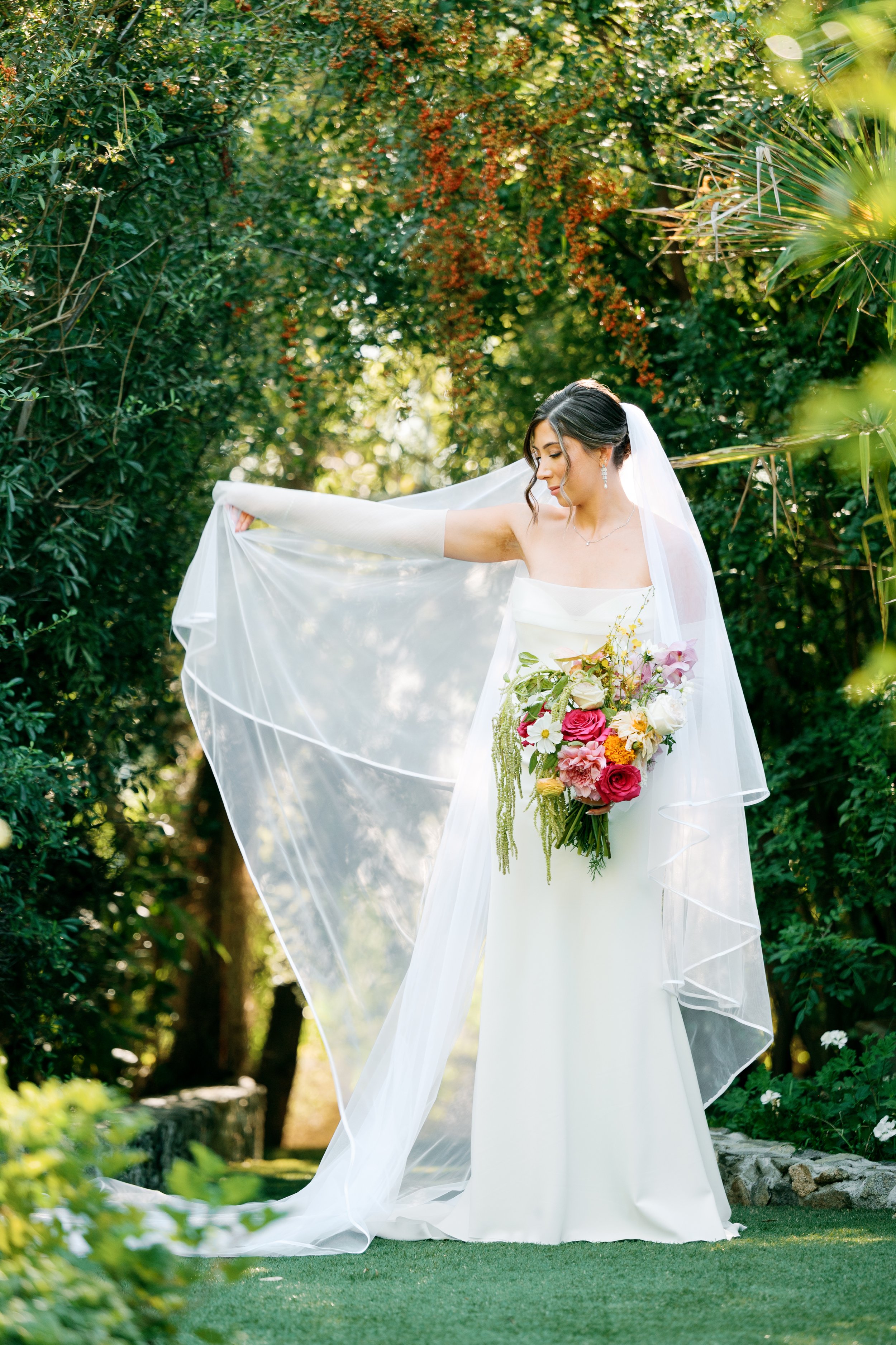 Full-length portrait of bride with veil at Tivoli Italian Villa in Escondido, California