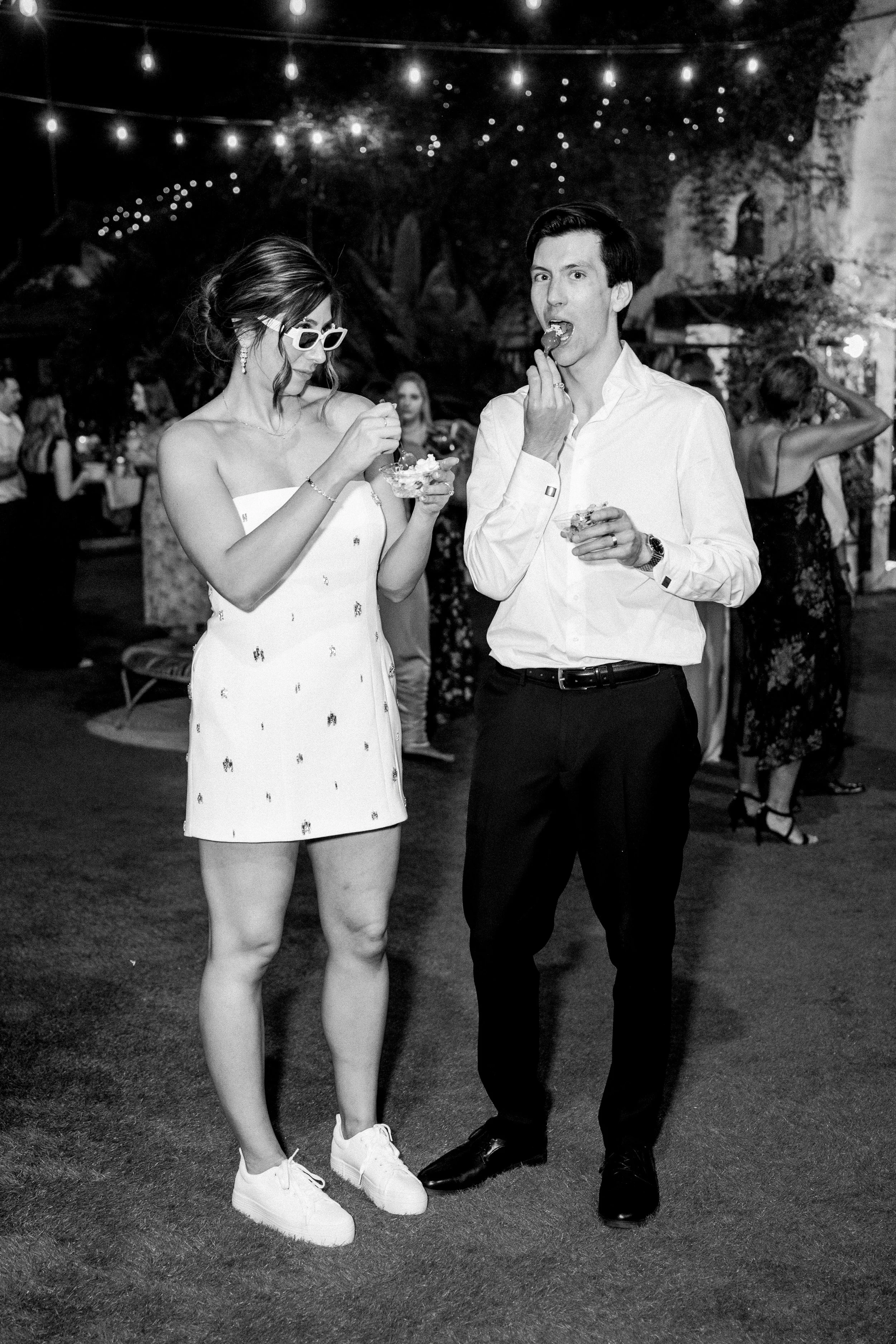 Bride and groom at ice cream bar during wedding reception at Tivoli Italian Villa in Escondido, California