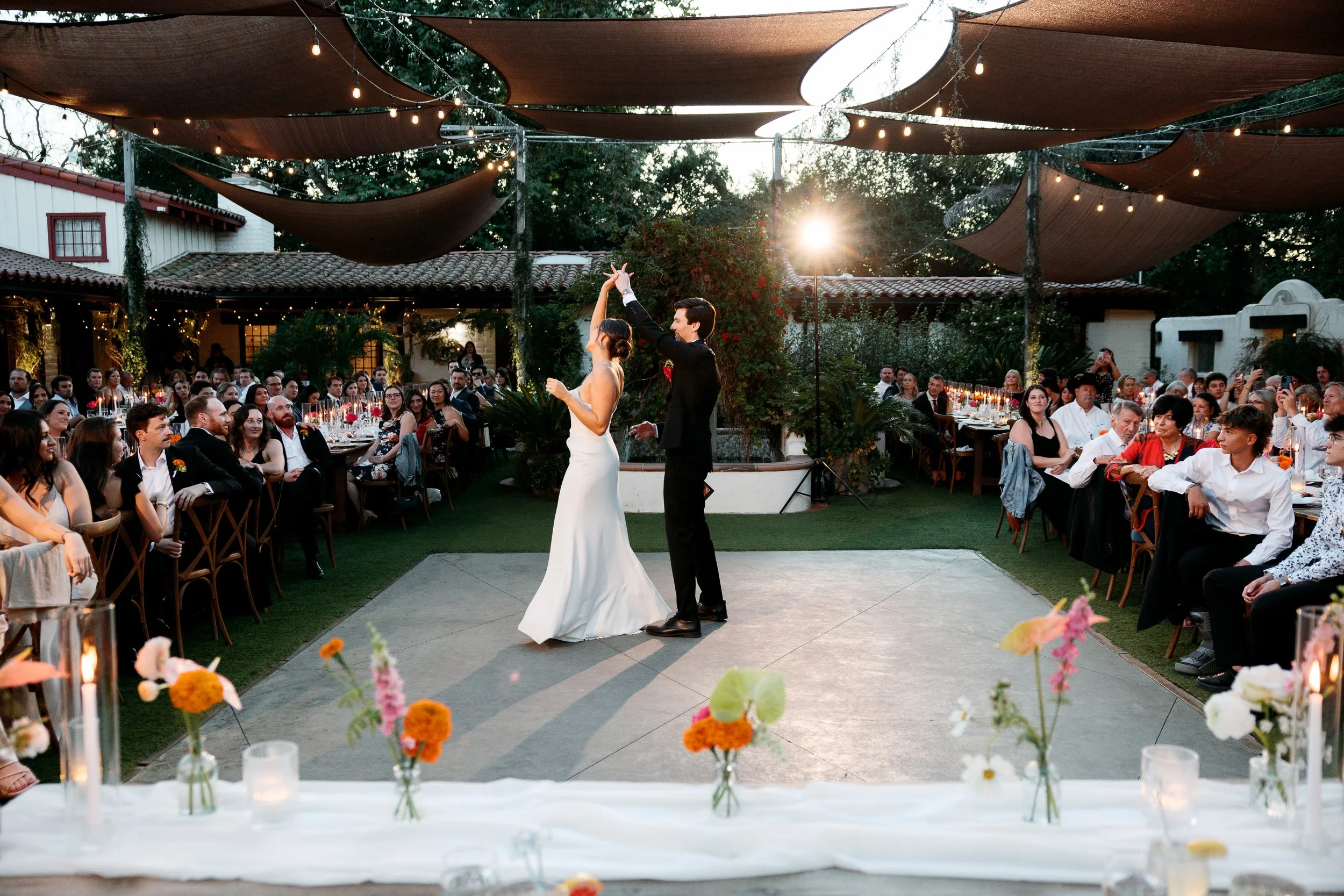 Bride and groom sharing their first dance at Tivoli Italian Villa wedding reception in Escondido, California