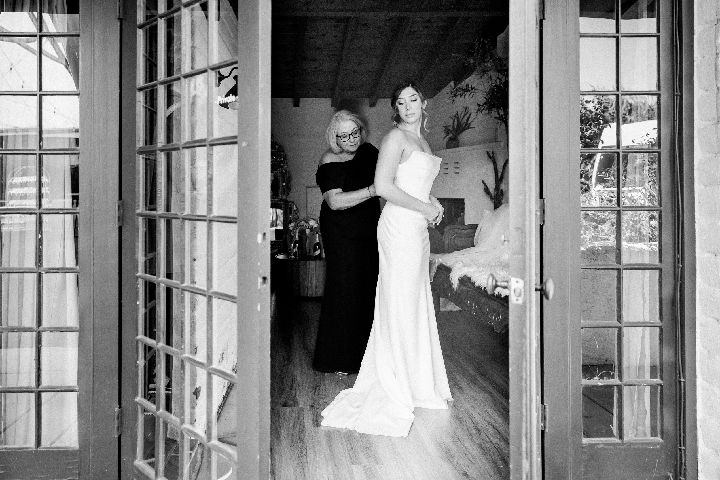 Bride getting ready at Tivoli Italian Villa in Escondido with soft window light
