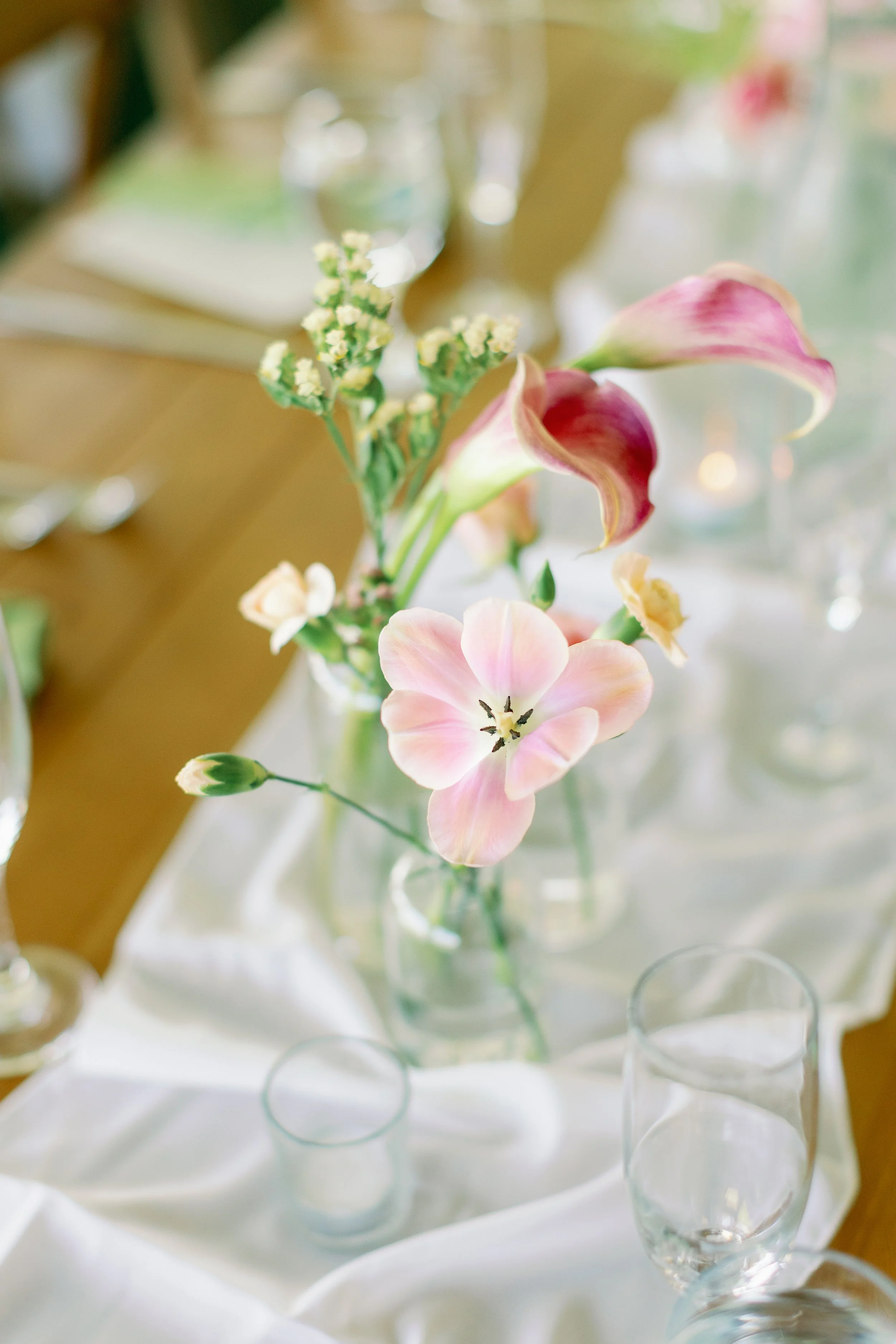 Reception decor with florals and candles at a California wedding