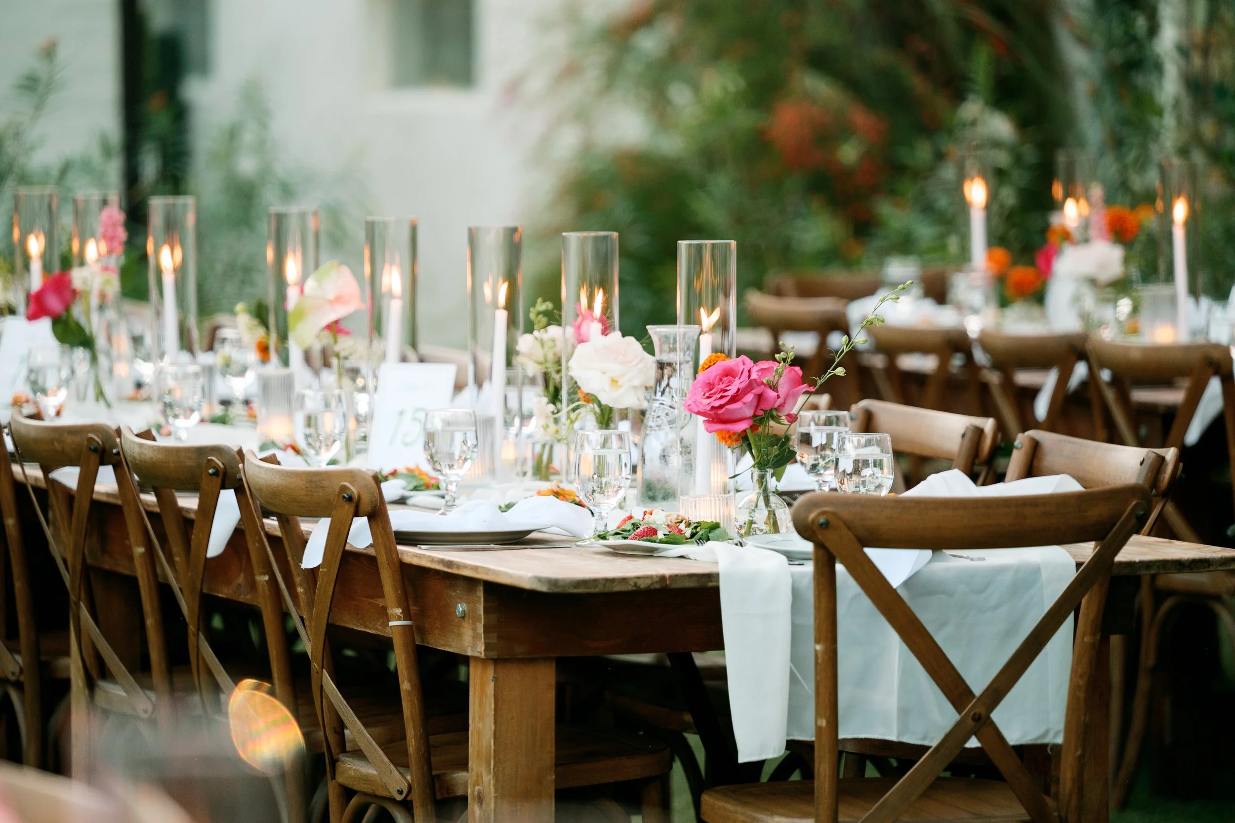 Reception table detail with floral arrangements and place settings at Tivoli Italian Villa wedding in Escondido, California