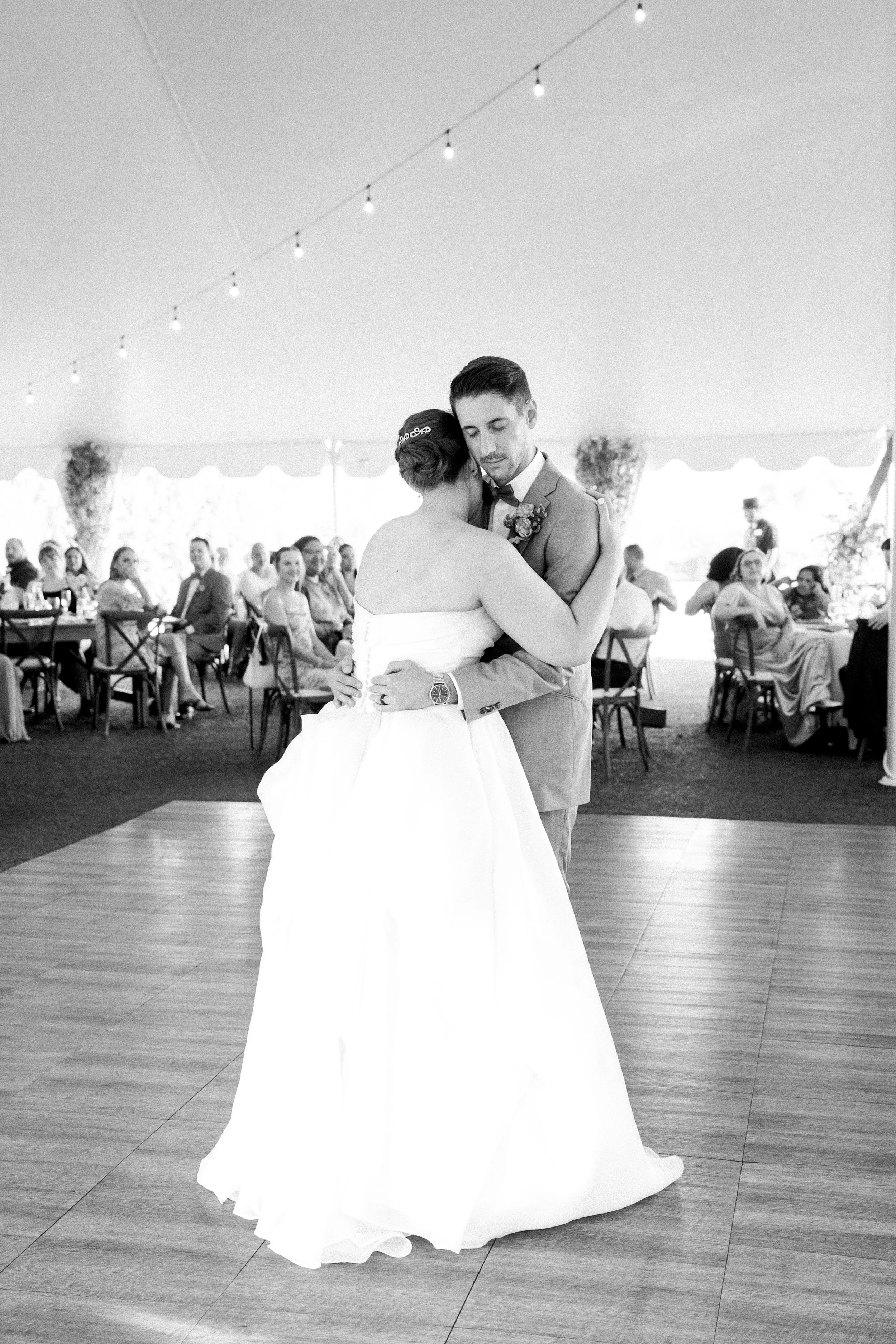 Black and white photo of first dance with bride and groom at San Diego venue