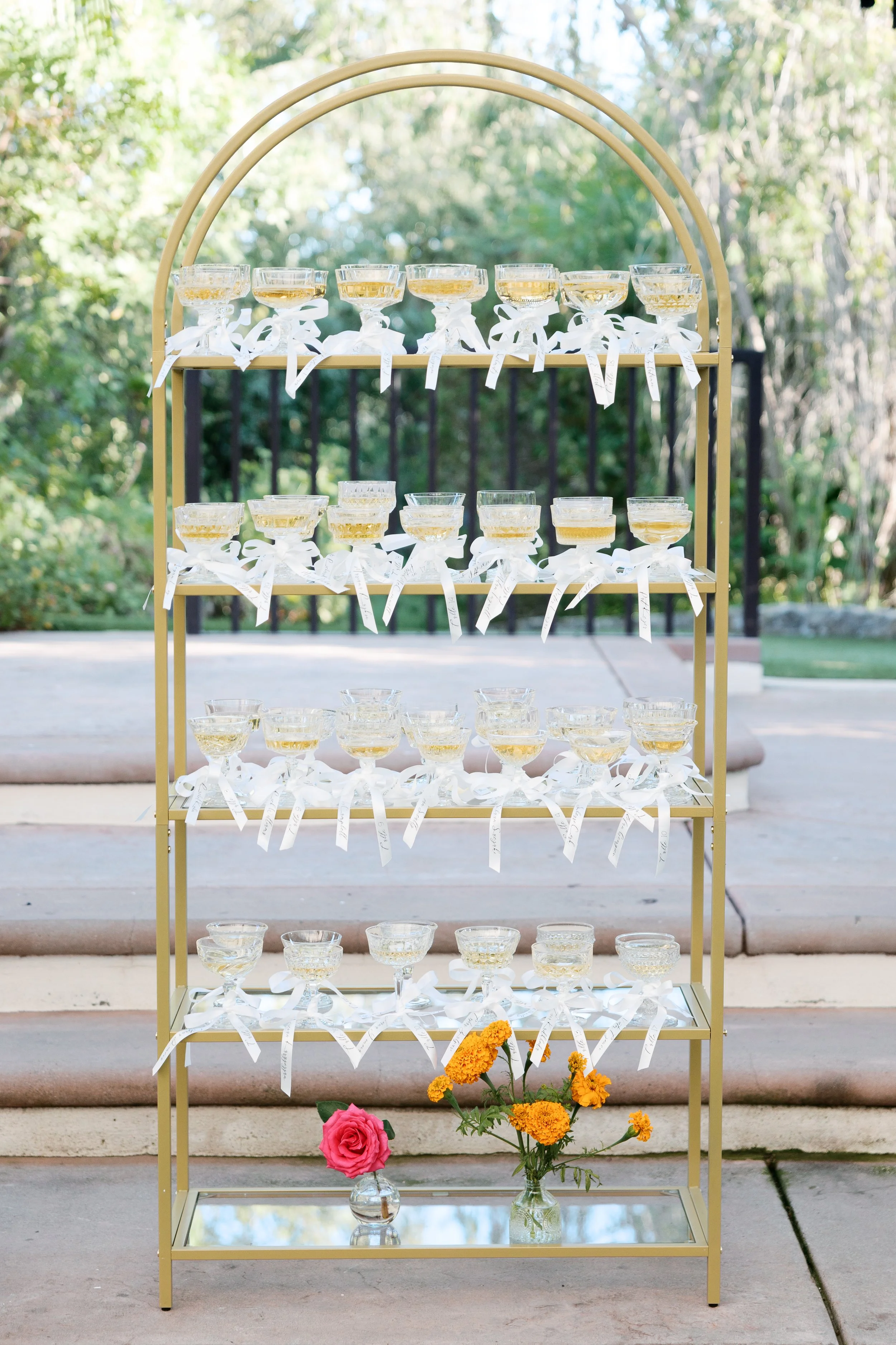 Champagne wall guest seating chart detail at Tivoli Italian Villa wedding in Escondido, California