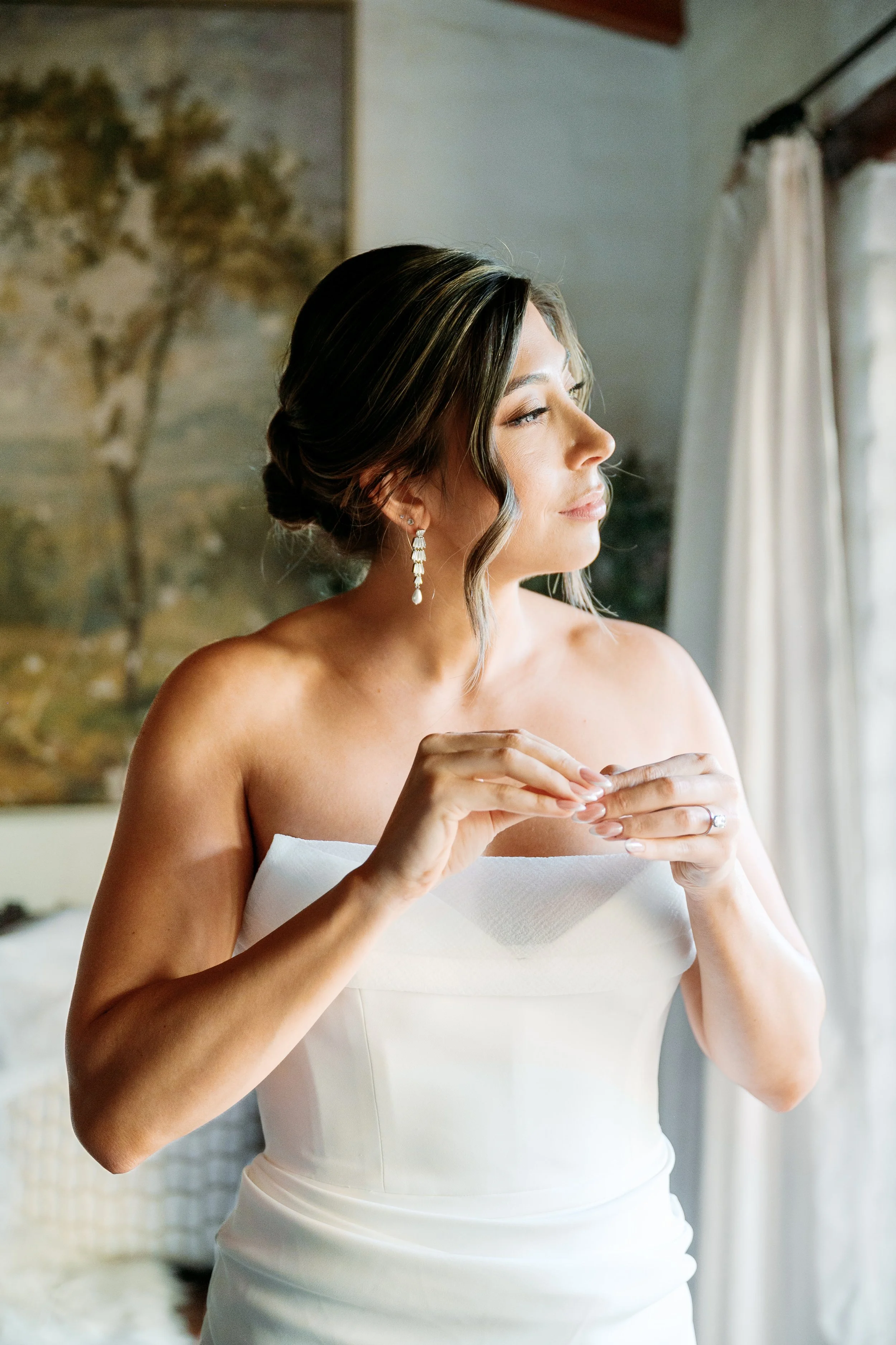 Bride getting ready at Tivoli Italian Villa in Escondido with soft window light