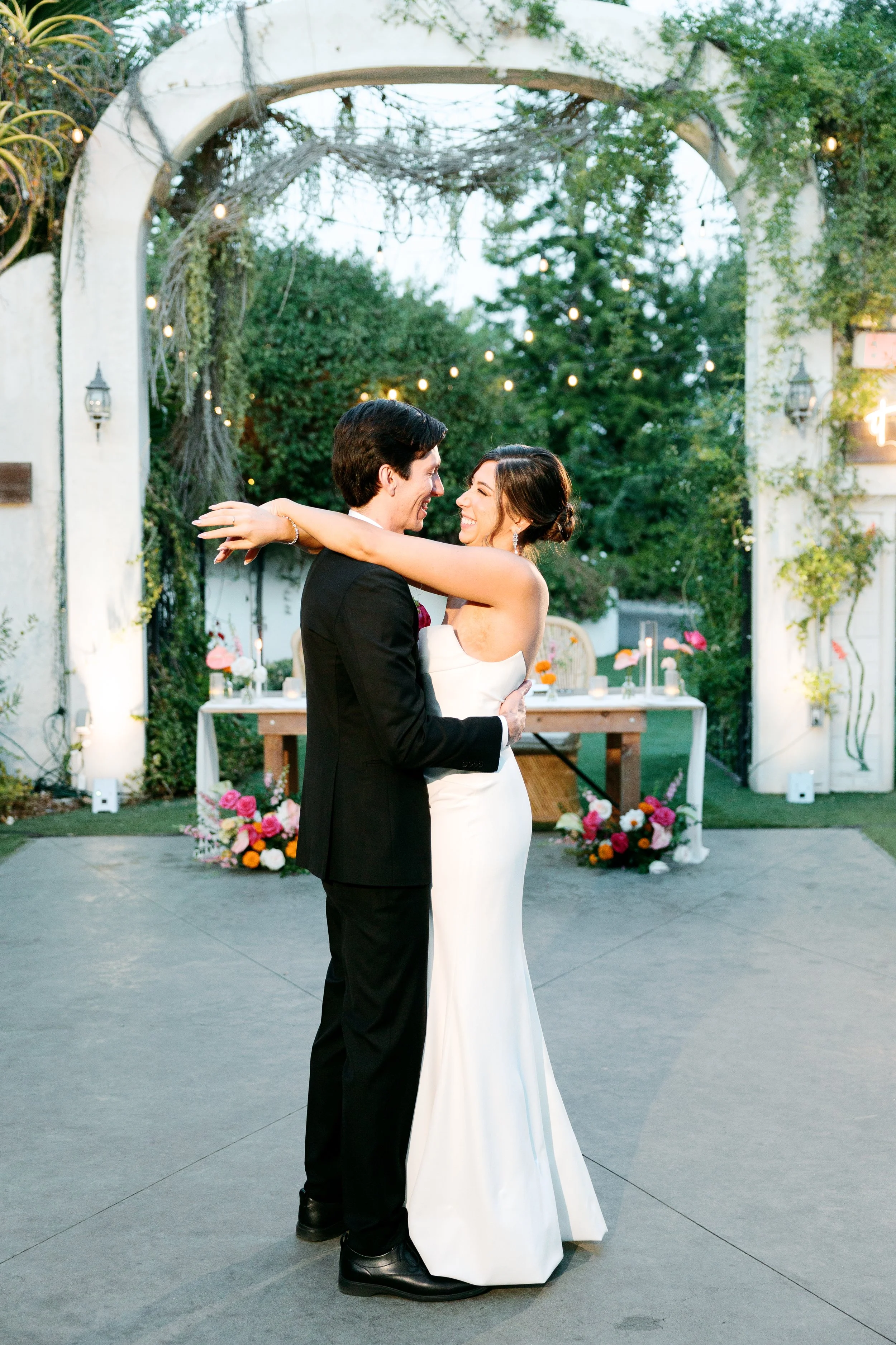 Bride and groom sharing their first dance at Tivoli Italian Villa wedding reception in Escondido, California