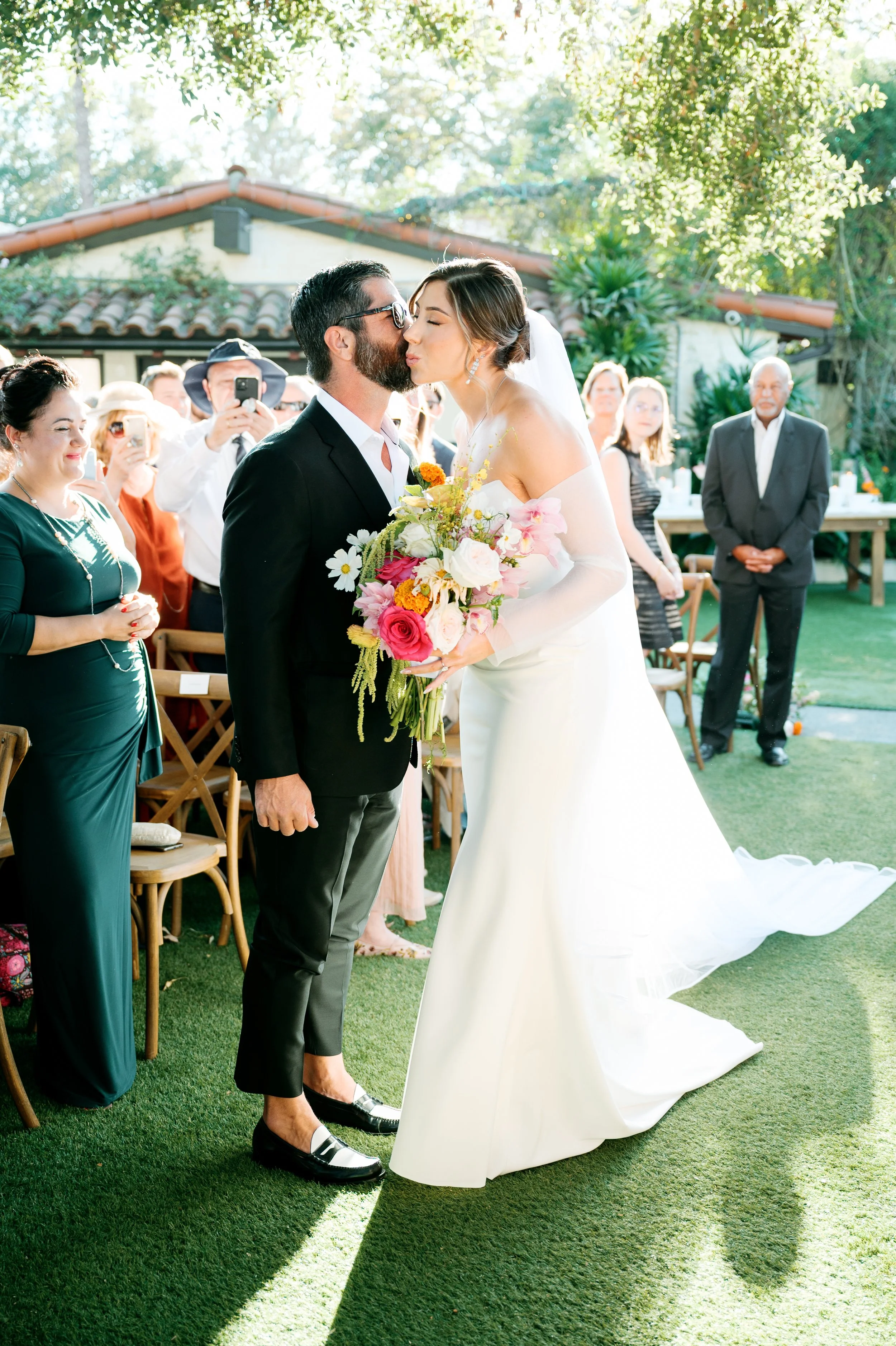 Bride walking down the aisle during the wedding ceremony at Tivoli Italian Villa in Escondido, California