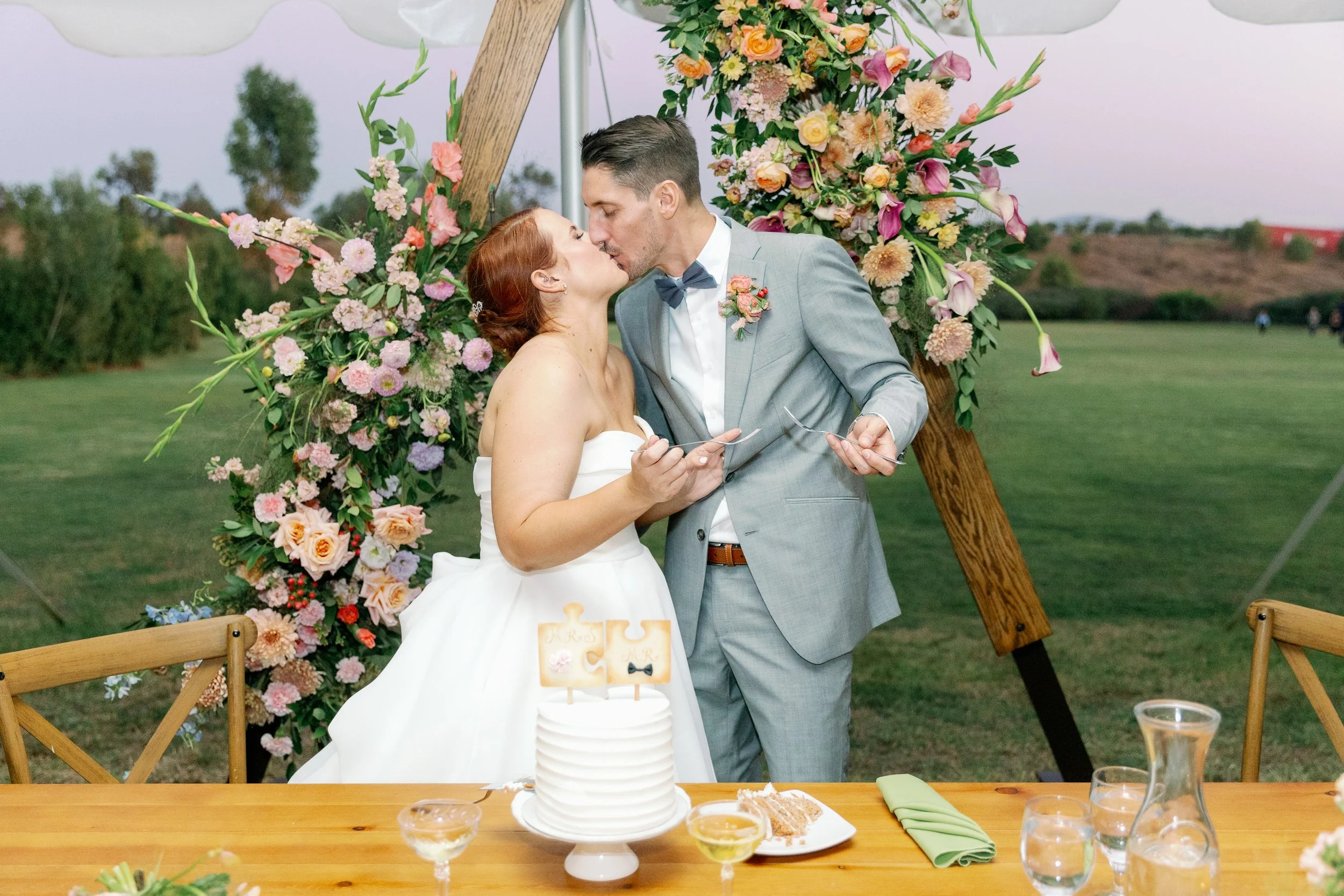 Candid reception moments during cake cutting at Ethereal Gardens