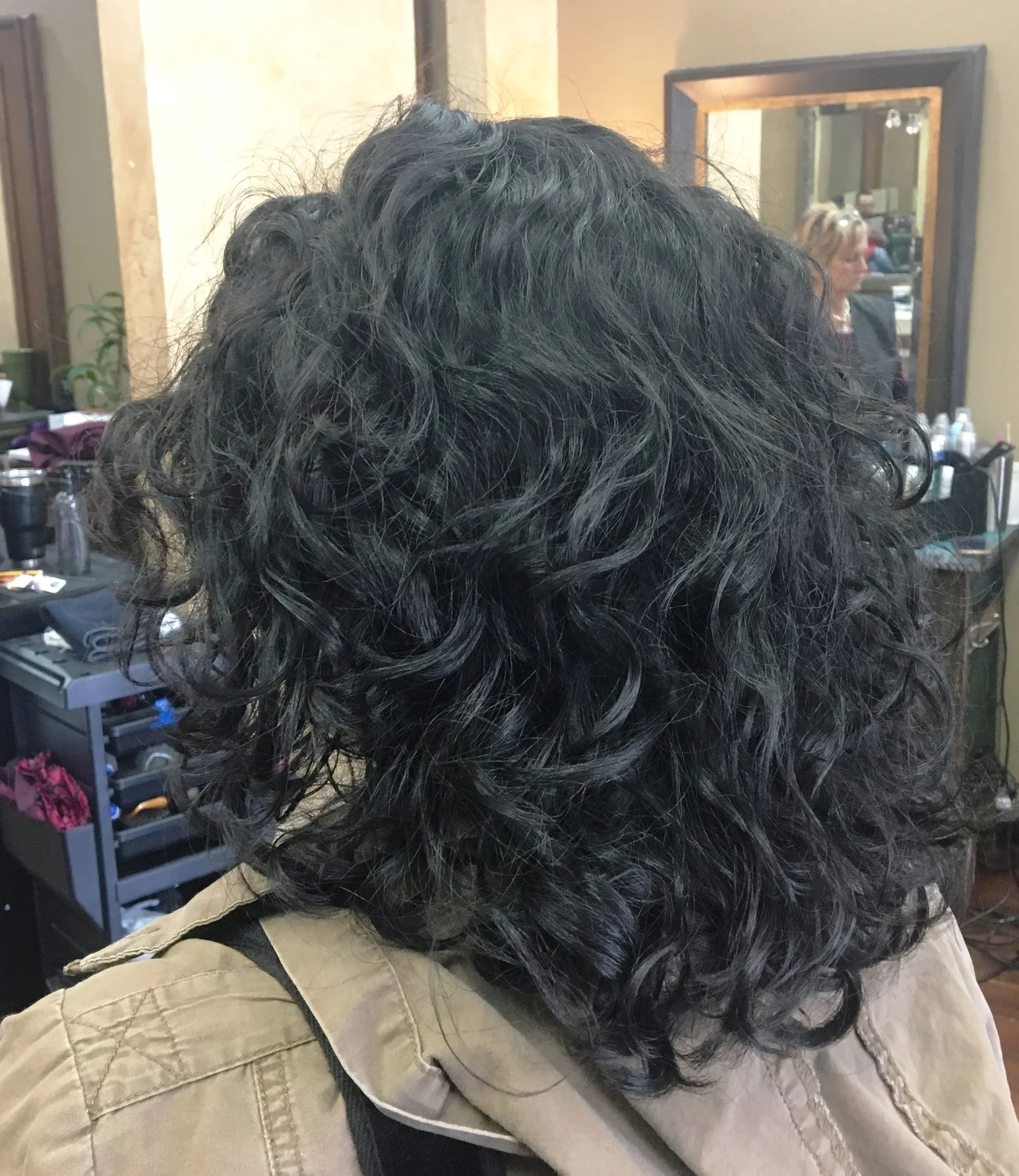 Curly hair texturized properly can give some amazing movement. This client's hair is layered and internally texturized. 