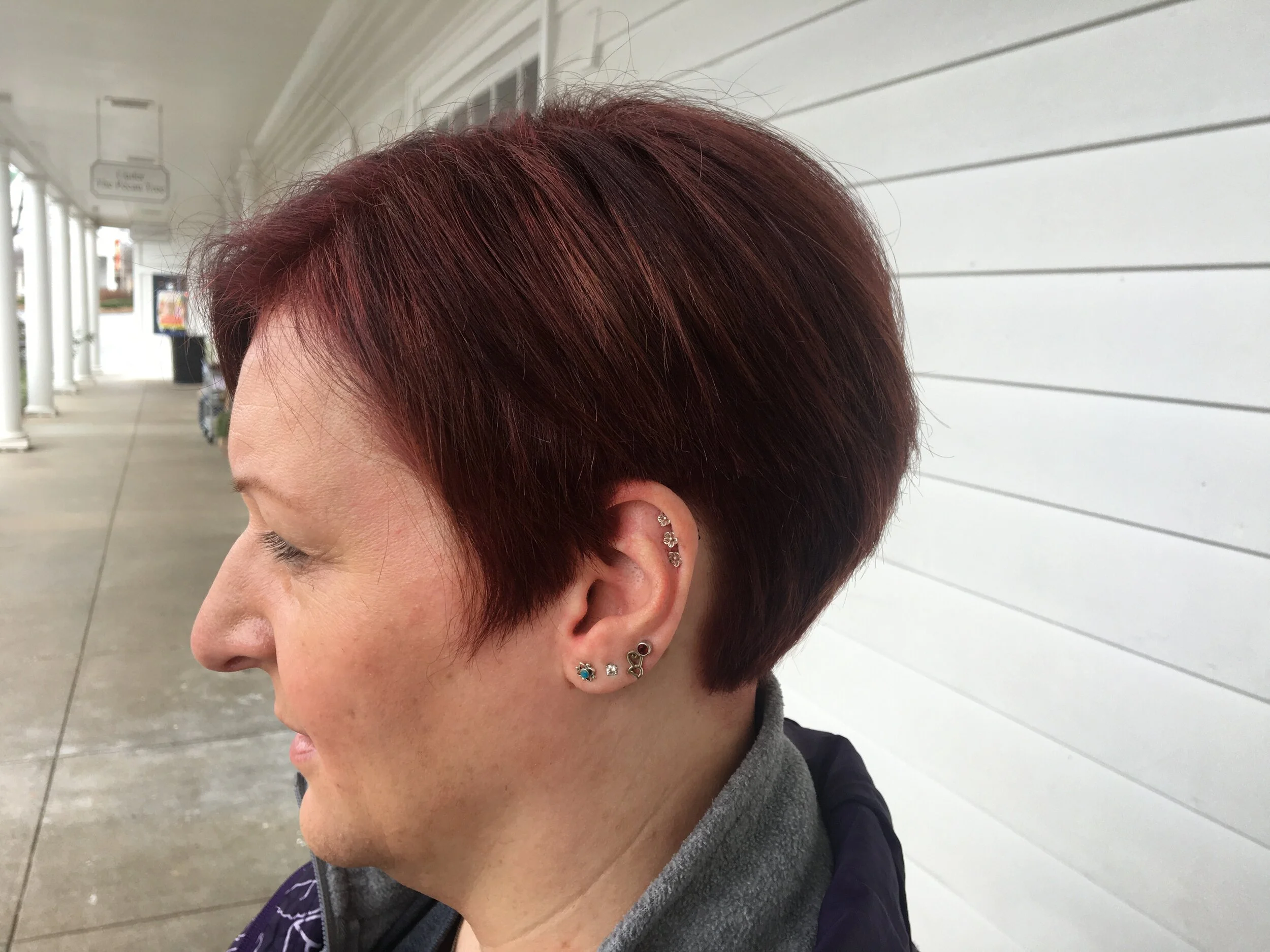 Short stacked triangle red layered hair cut/color