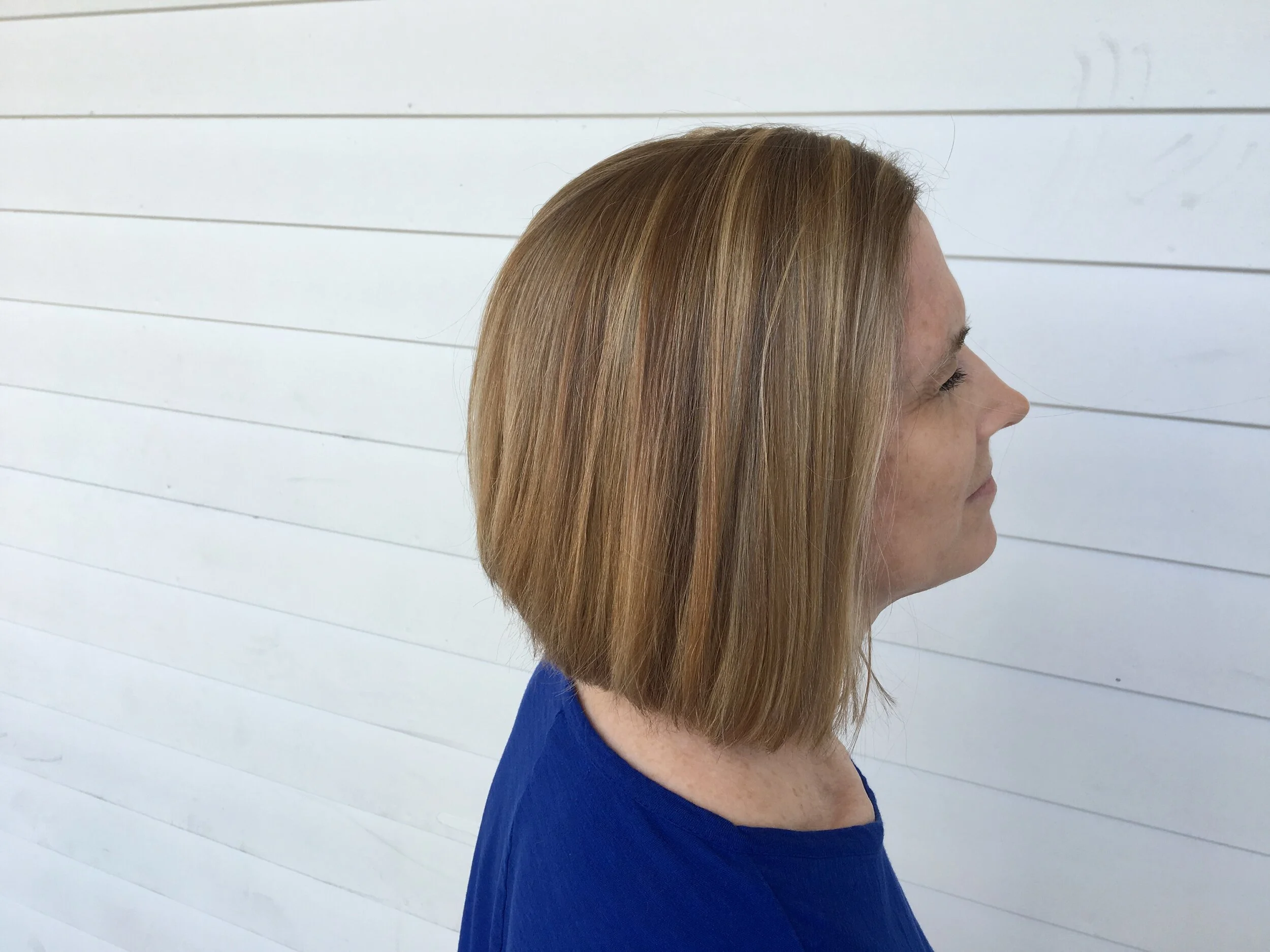 Short stacked honey blonde with high lights