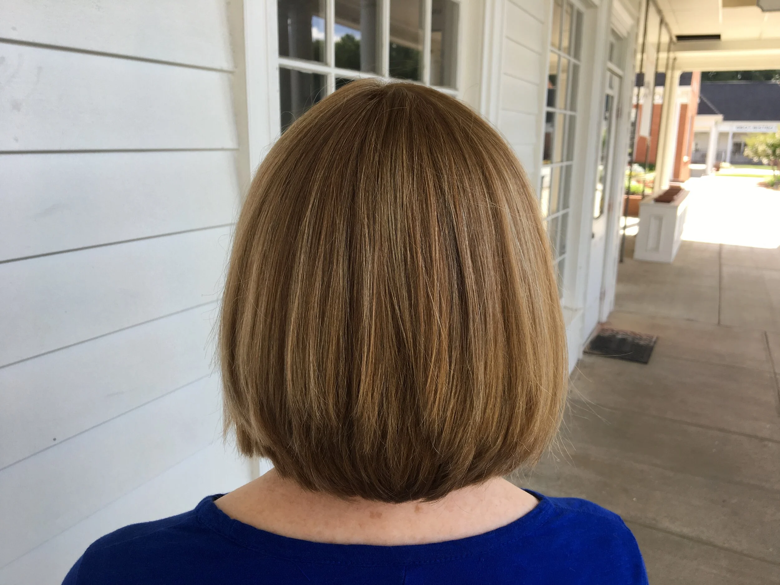 Short stacked layered honey blonde with high lights