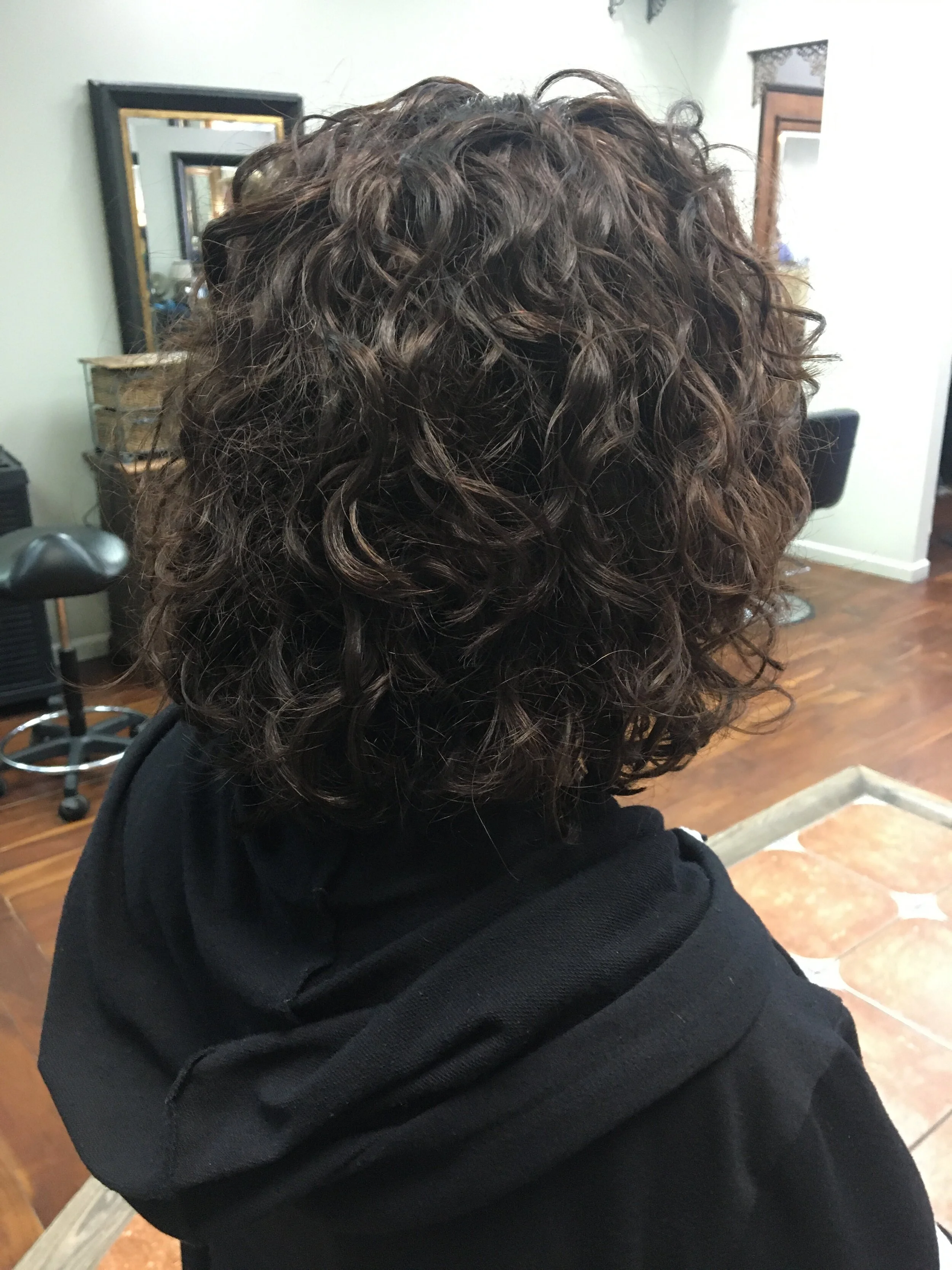  Medium brown curly hair 