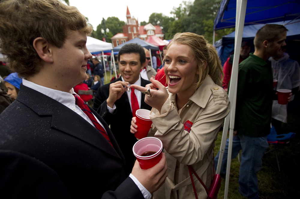 Chance Lauery, (from left) Charles Ponder and Julie Abdel along with fellow fans of Ole Miss Rebels football enjoy tailgating at The Grove on the University of Mississippi campus before the Rebels take on Texas A&M University.
