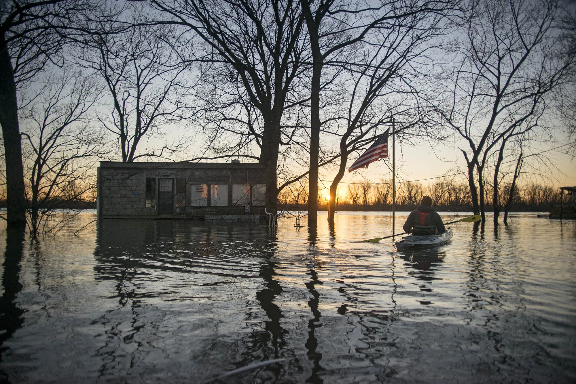 Settled on the River Side of the protective levees, Mound City and other communities were flooded under more than 12 feet of water in places despite being nearly three miles from the Mississippi River's main channel. Beside each floating structure a