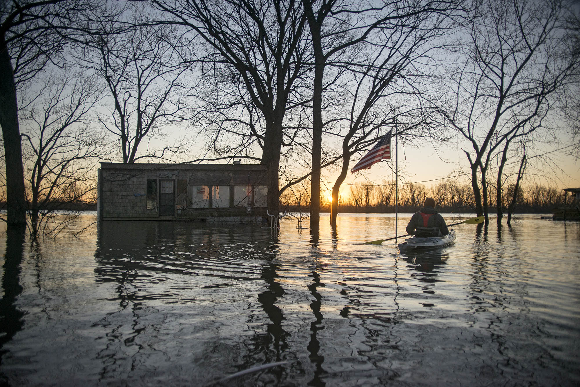 Settled on the River Side of the protective levees, Mound City and other communities were flooded under more than 12 feet of water in places despite being nearly three miles from the Mississippi River's main channel. Beside each floating structure are single-story homes, sheds and other structures hidden underwater, completely inundated by the flood.